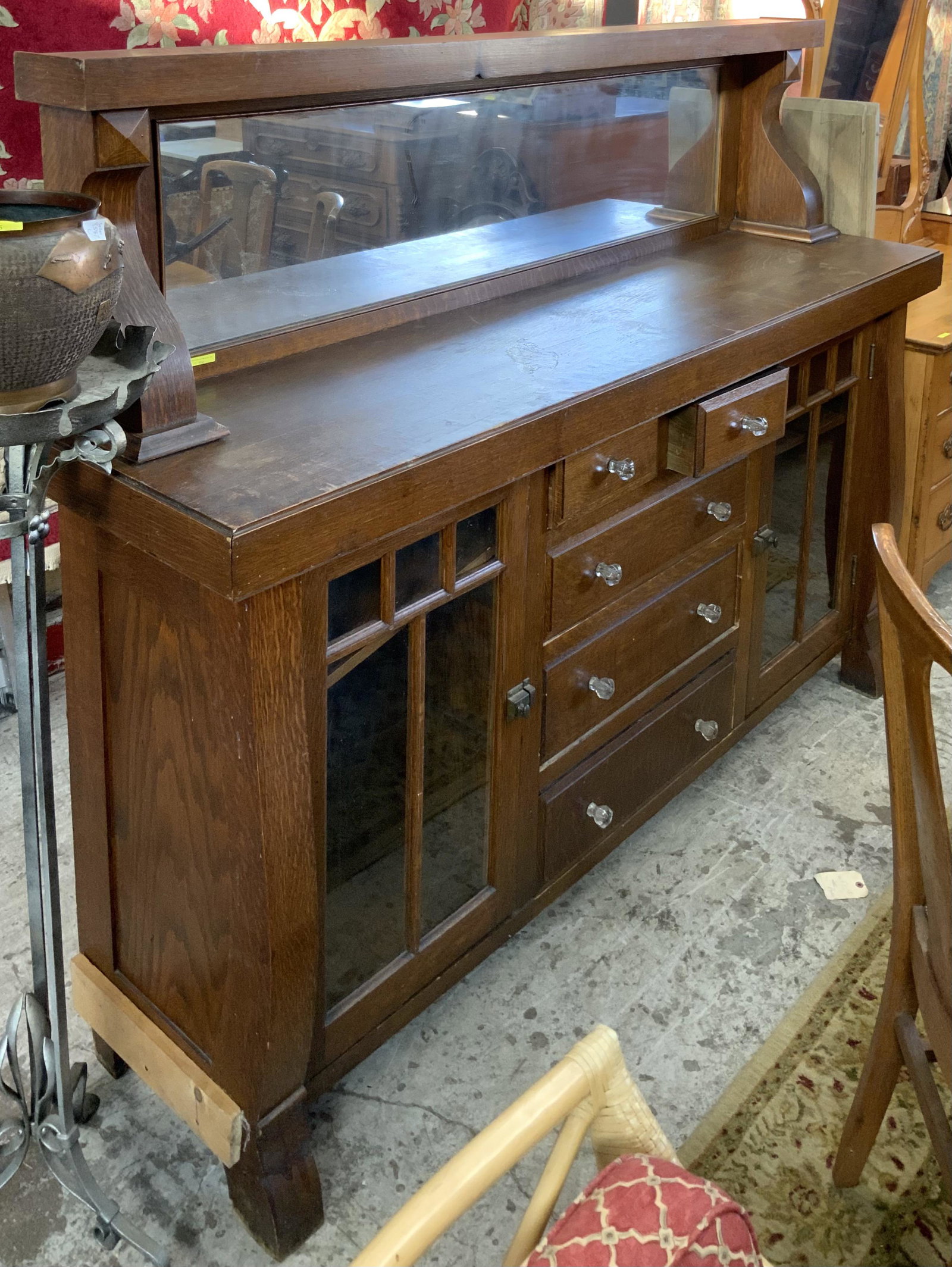 Antique Oak Buffet with Mirrored Backsplash.: Looks Like the Side is Damaged on One Side, as there is a Board Attached to It. Measures 5' Tall and 6' 6" Wide. Third-Party Freight Shipping or Personal Pickup Required.