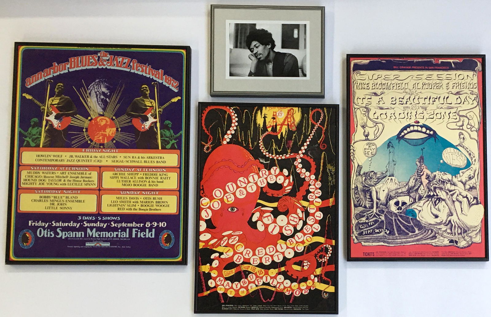 Lot: 3 Framed Concert Posters, Jimi Hendrix Photo.: Frames are newer. The Country Joe and Mike Bloomfield poster frames each measure 14.25" x 21.25". The Ann Arbor Blues & Jazz poster frame measures 17.25" x 22.25". The Jimi Hendrix photo frame measure