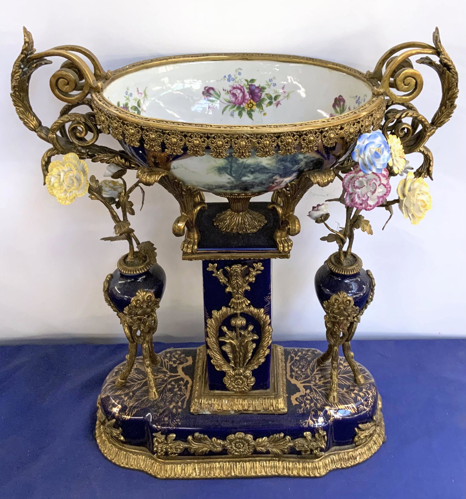 Large, Ornate Metal & Porcelain Centerpiece.: With Floral Decorations. Contemporary. Measures 23 1/2" Tall, 20" Wide, and 9 1/2" Deep. Third-Party Shipping or Personal Pickup Required.