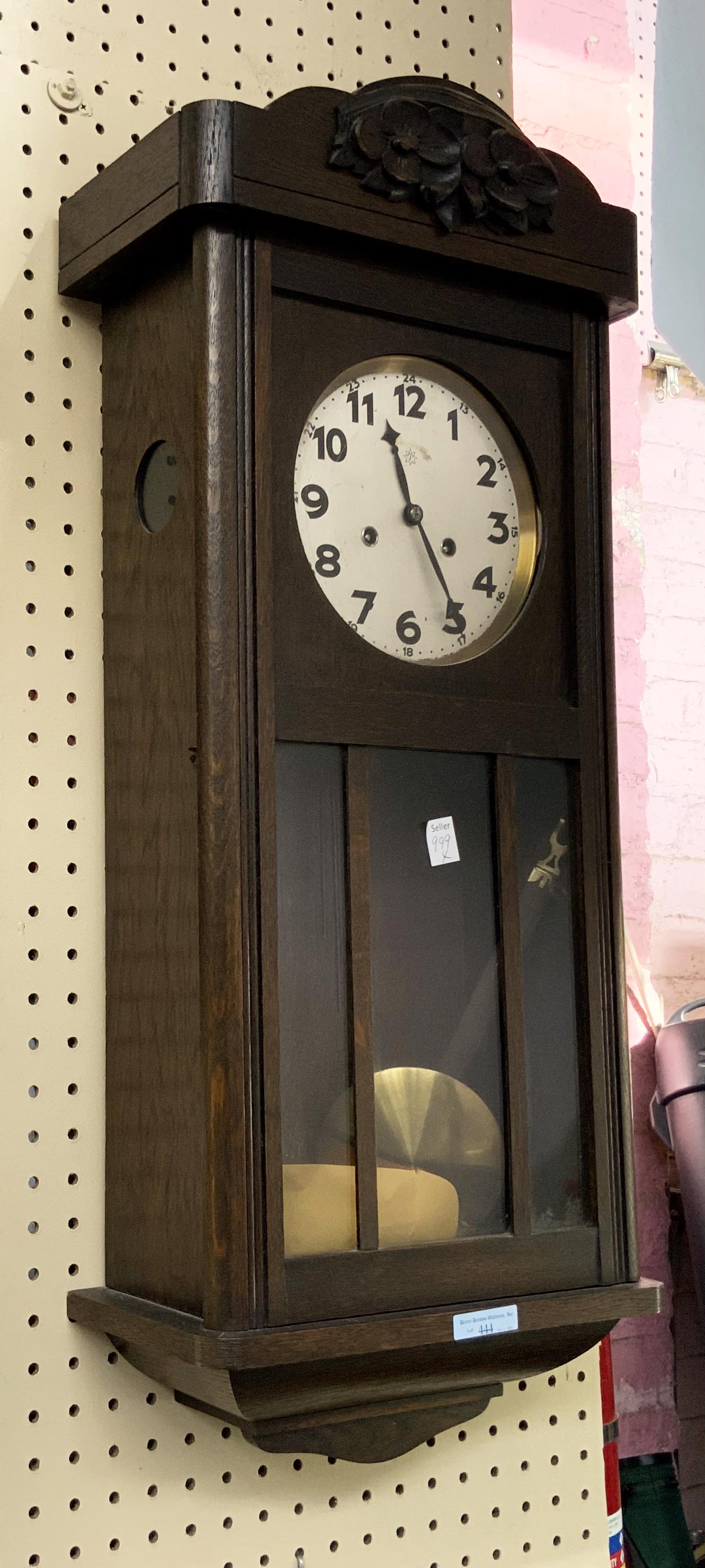 Carved Oak Wall Clock.: Maker Unknown. Working Condition is Unknown. Measures 30" Tall, 12 1/2" Wide and 6" Deep. Third-Party Shipping or Personal Pickup Required.