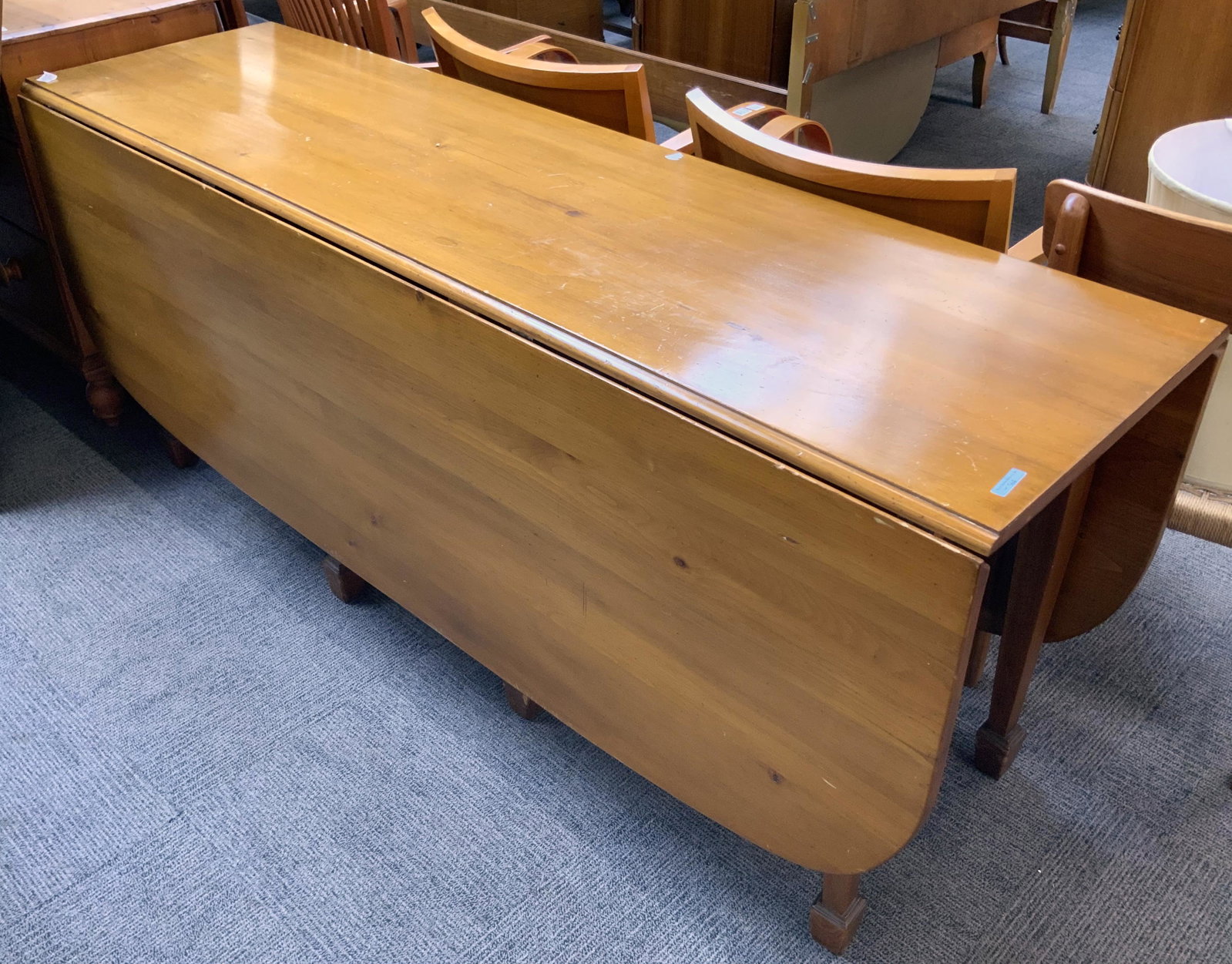 6' Long Dropleaf Wood Table.: Measures 20" Wide with the Leaves Down and 62" Wide when Expanded. Measures 30" Tall. Third-Party Freight Shipping or Personal Pickup Required.