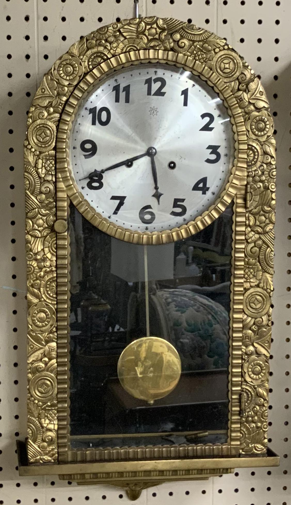 Heavy Brass or Bronze Junghans Wall Clock.: Dimensions are 14" x 26" x 5.5". Working condition is unknown. Good cosmetic condition. Very heavy and bulky item. Third-Party Shipping or Personal Pickup Required.