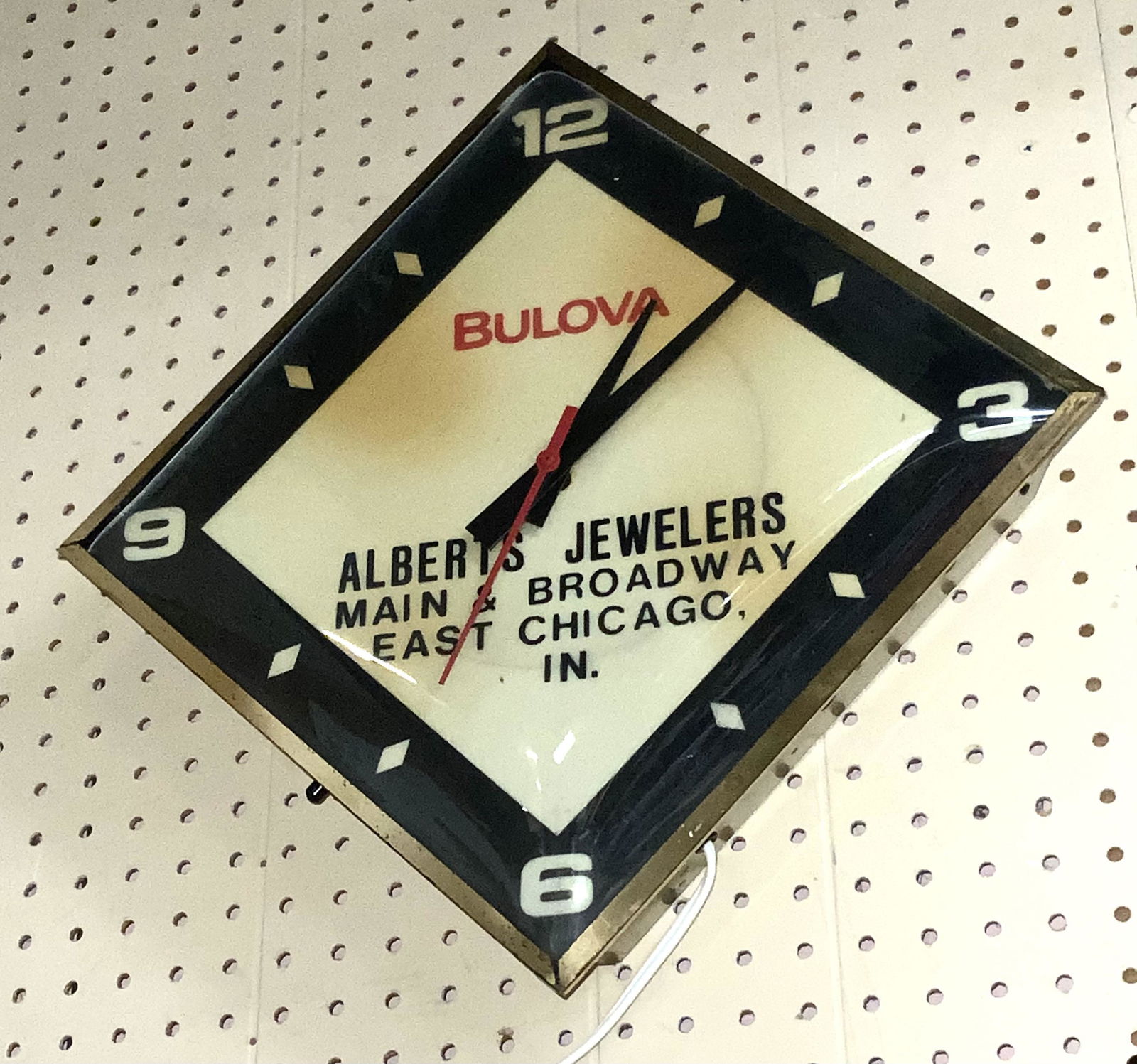 Vintage Bulova Advertising Wall Clock.: It Works. Not a Lit Clock. The Clock has a Couple of Darker Areas on the Face. An Advertising Clock for Albert's Jewelers in East Chicago, Indiana. It Measures 18" Long and 18" Wide (From Point to Poi