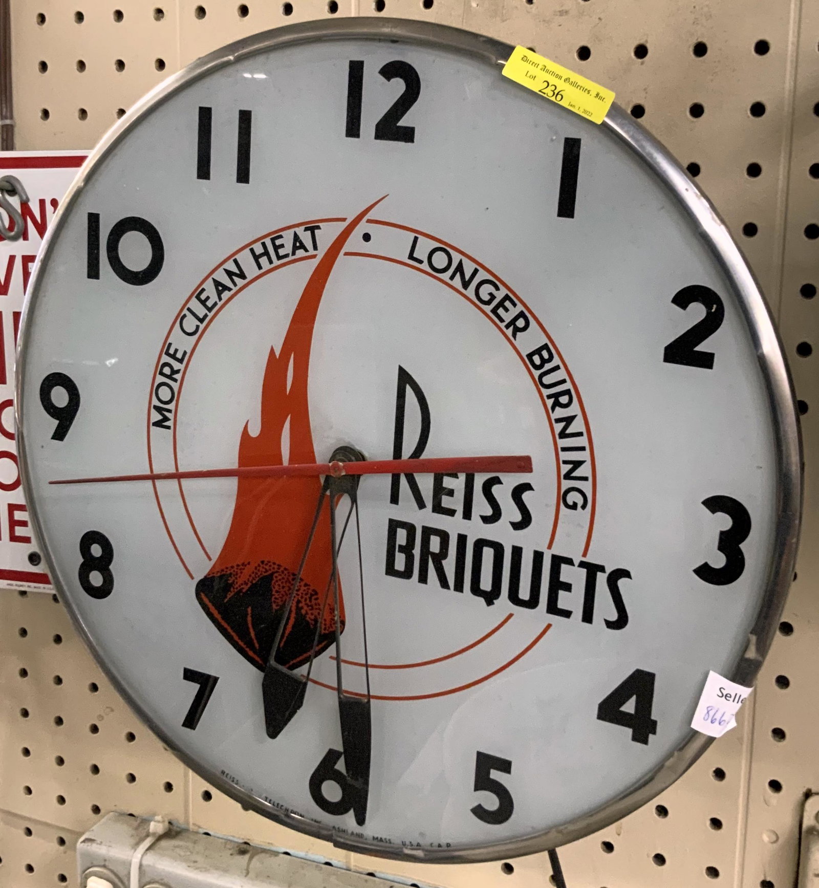 Vintage Plug-In Advertising Clock- Reiss Briquets.: Telechron clock that keeps time well, also lights up. Measures 14.5" in diameter. Some scuffs and dings, but overall nice condition. Third-Party Shipping or Personal Pickup Required.