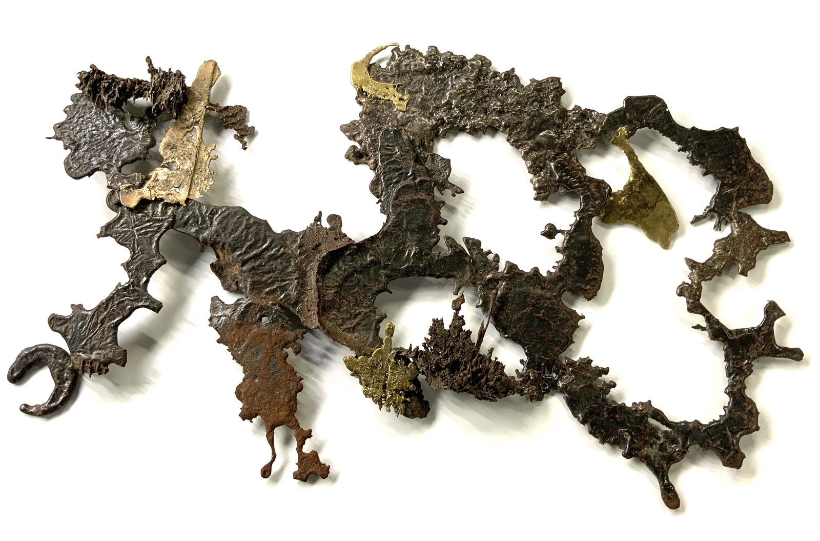 Mid-Century Abstract Metal Wall Sculpture.: Quite heavy, also has some rough edges. Measures approximately 40" x 26". Third-Party Shipping or Personal Pickup Required.