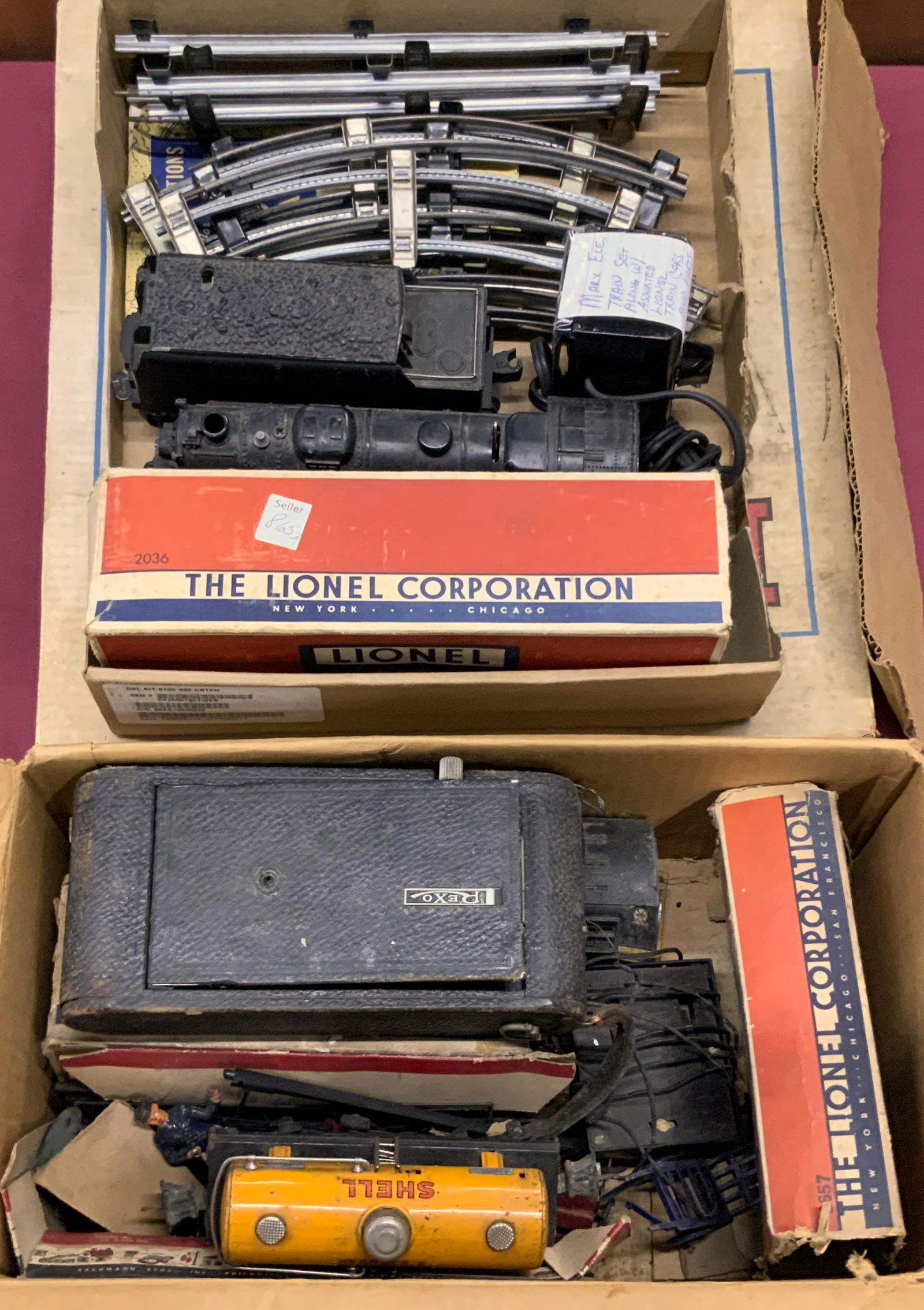 Lot of Mostly Lionel and Marx Trains.: A Marx 21325M Train Set, Complete in Box (Underneath it all). Also, a Lionel 2036 Engine w/Tender, a Lionel 226E Engine & Tender (Lots of Mold and Dirt on them), a Lionel 2654 Shell Tanker Car, a Lion