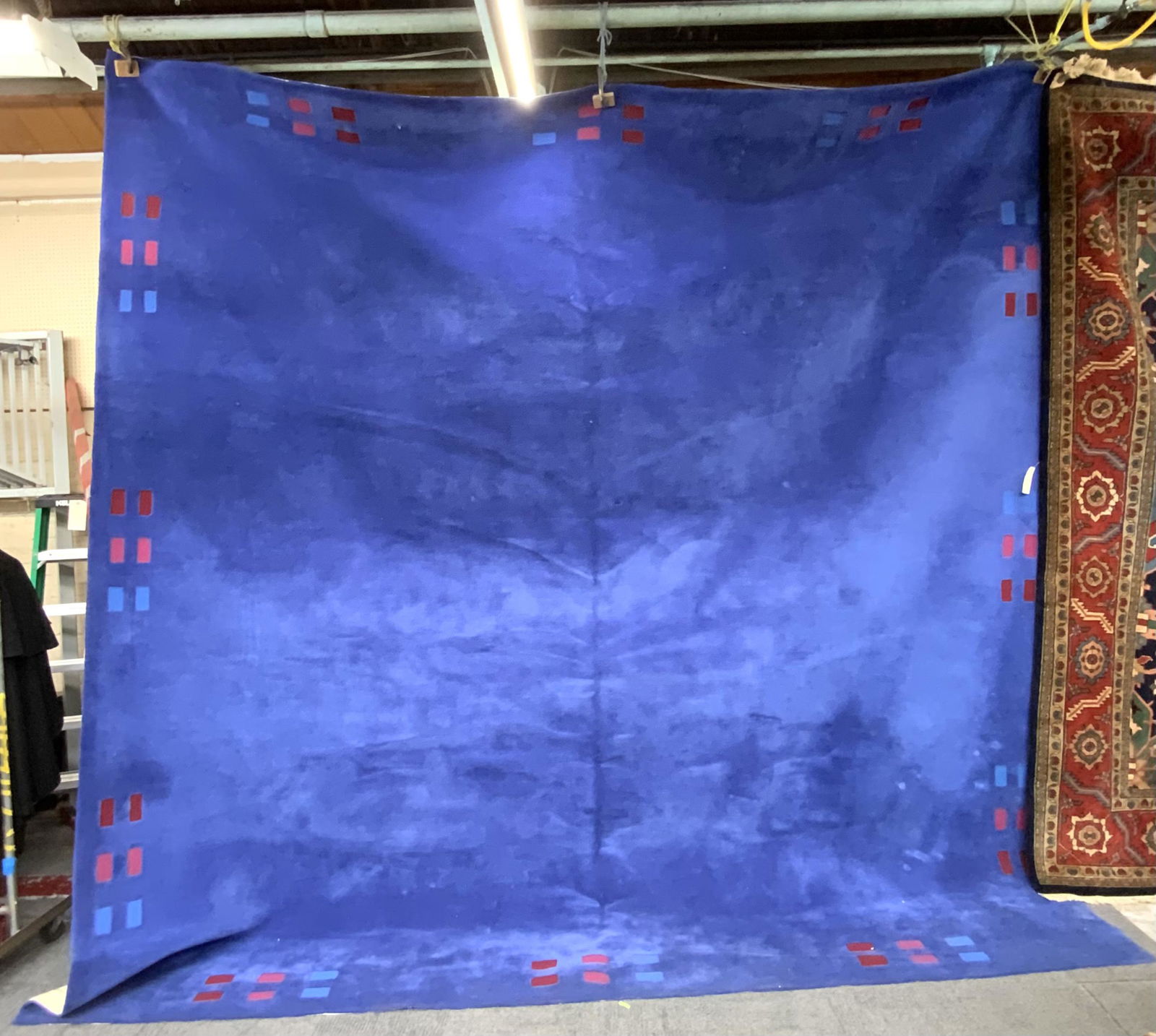 13' 10" x 13' 10" Edward Fields Type Rug.: Mostly Blue, with Red Rectangles along the Border. Constructed very Similarly to an Edward Fields Rug, but it is not Signed. A Thick and Heavy Rug. Third-Party Shipping or Personal Pickup Required.