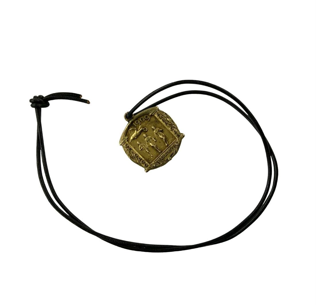 1909 Chicago American Marathon Bronze Medal.: On a Cord. The Medal or Pendant Measures 1 1/4" Long by 1 1/4" Wide.