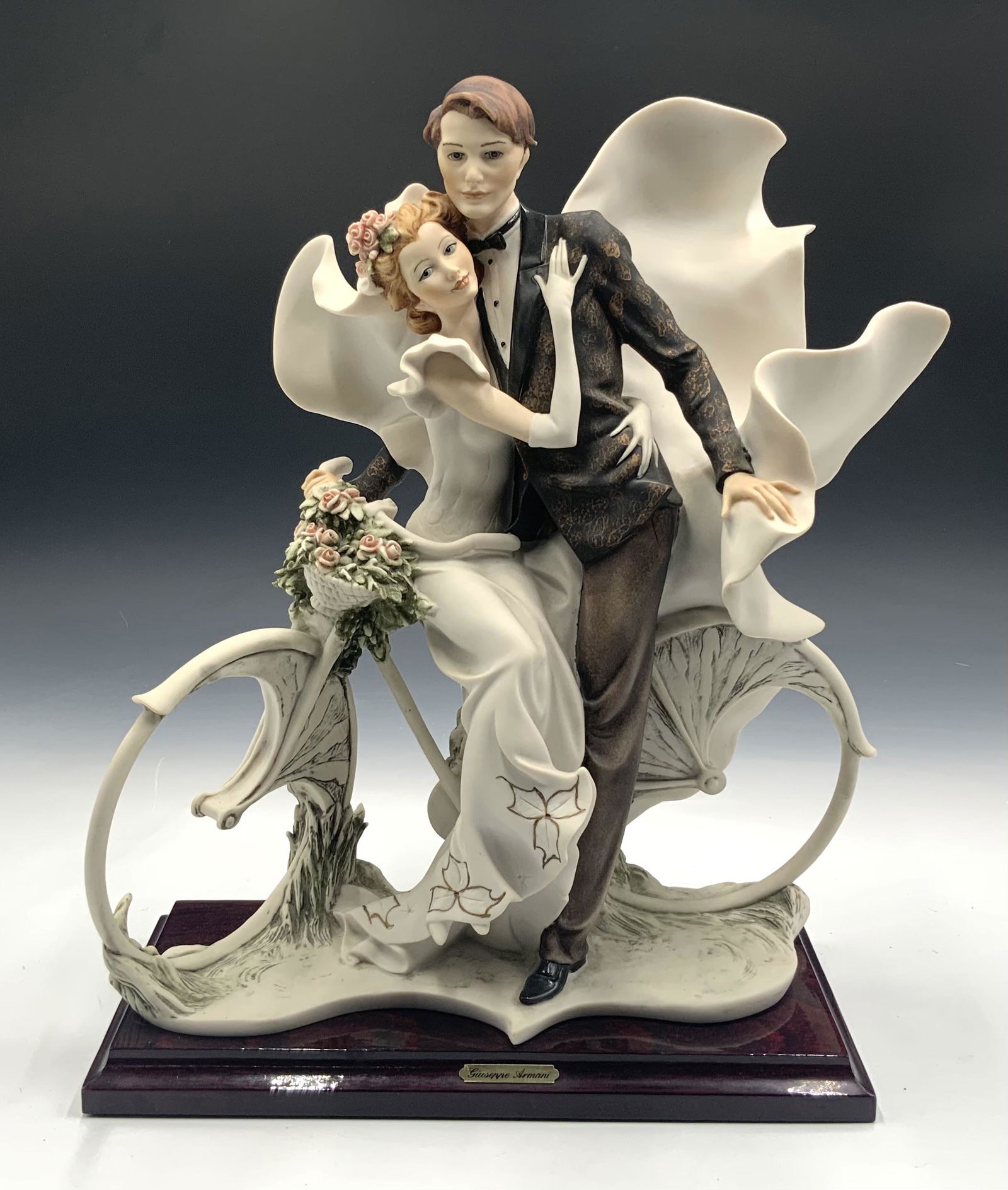 Giuseppe Armani Figurine of Wedding Couple.: 14.5" tall. Looks to be in very nice condition. Wood base is attached. Third-Party Shipping or Personal Pickup Required.