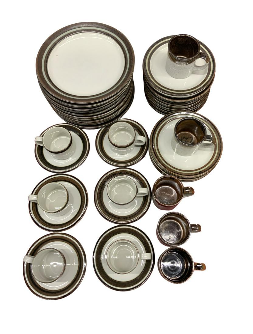 Arabia "Karelia" Pottery China Set.: Consists of 16 Dinner Plates (One Plate has a Spiderweb-like Crack in it, the Plates show some Use), 21 Smaller Plates (7 3/4" Diameter), 5 Mugs, and 6 Cup and Saucer Sets. Third-Party Shipping or Per