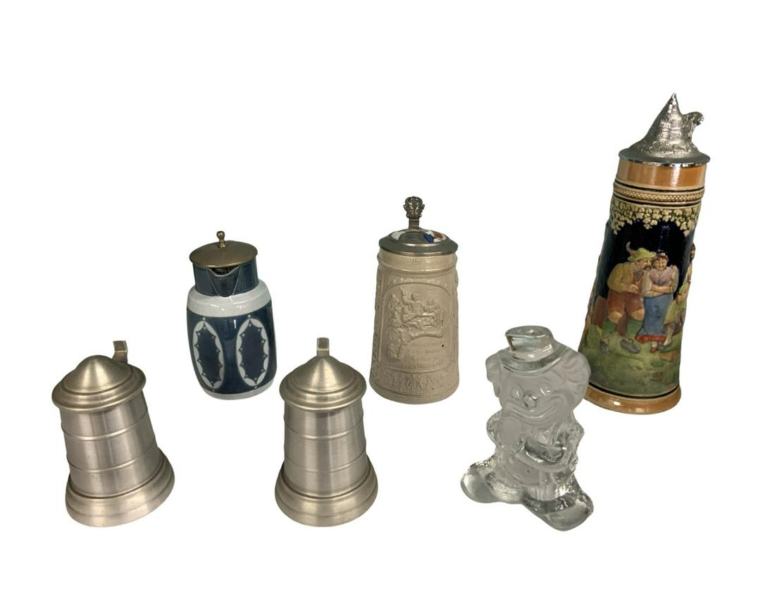 Lot of Assorted Steins & Glass Clown Figure.: One of the Steins is a German Salt-Glaze Stein, with a Hand-Painted Porcelain Top with a Portrait of a German Man Drinking a Beer. This Stein Measures 8" Tall. Also Included is a German High-Glaze Pit