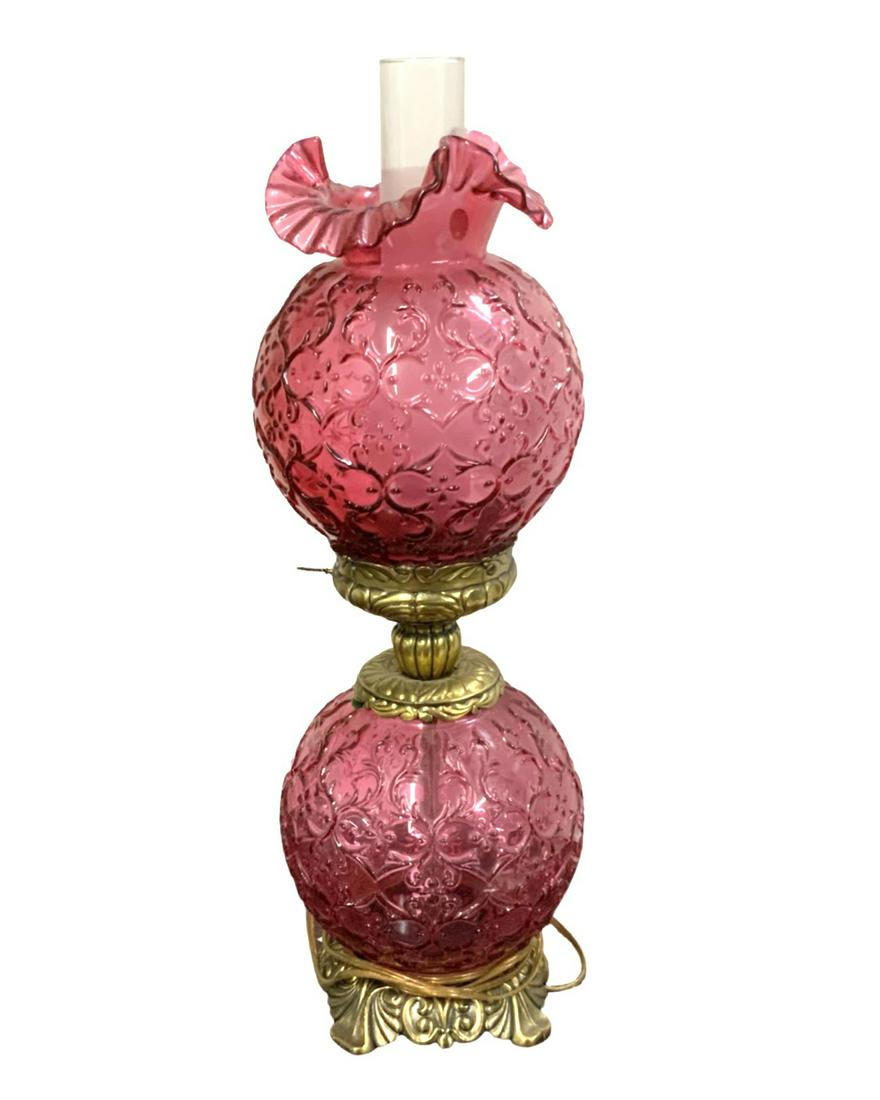 Fenton Cranberry Glass Lamp.: Gone with the Wind Style. It Leans a Little Bit to the Left, so it May need some Adjusting. Measures 24" Tall to the Top of the Chimney. Third-Party Shipping or Personal Pickup Required.