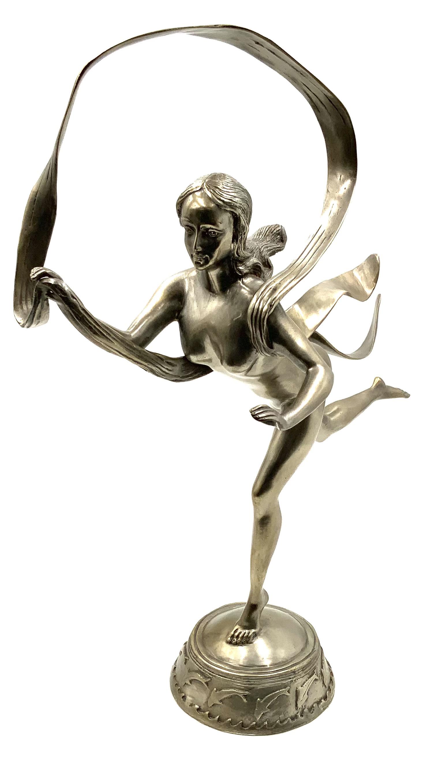 Metal Sculpture of Nude Woman after Paul Manship.: With Dolphins Circling the Base. Measures 23" Tall and 19" Wide. Third-Party Shipping or Personal Pickup Required.