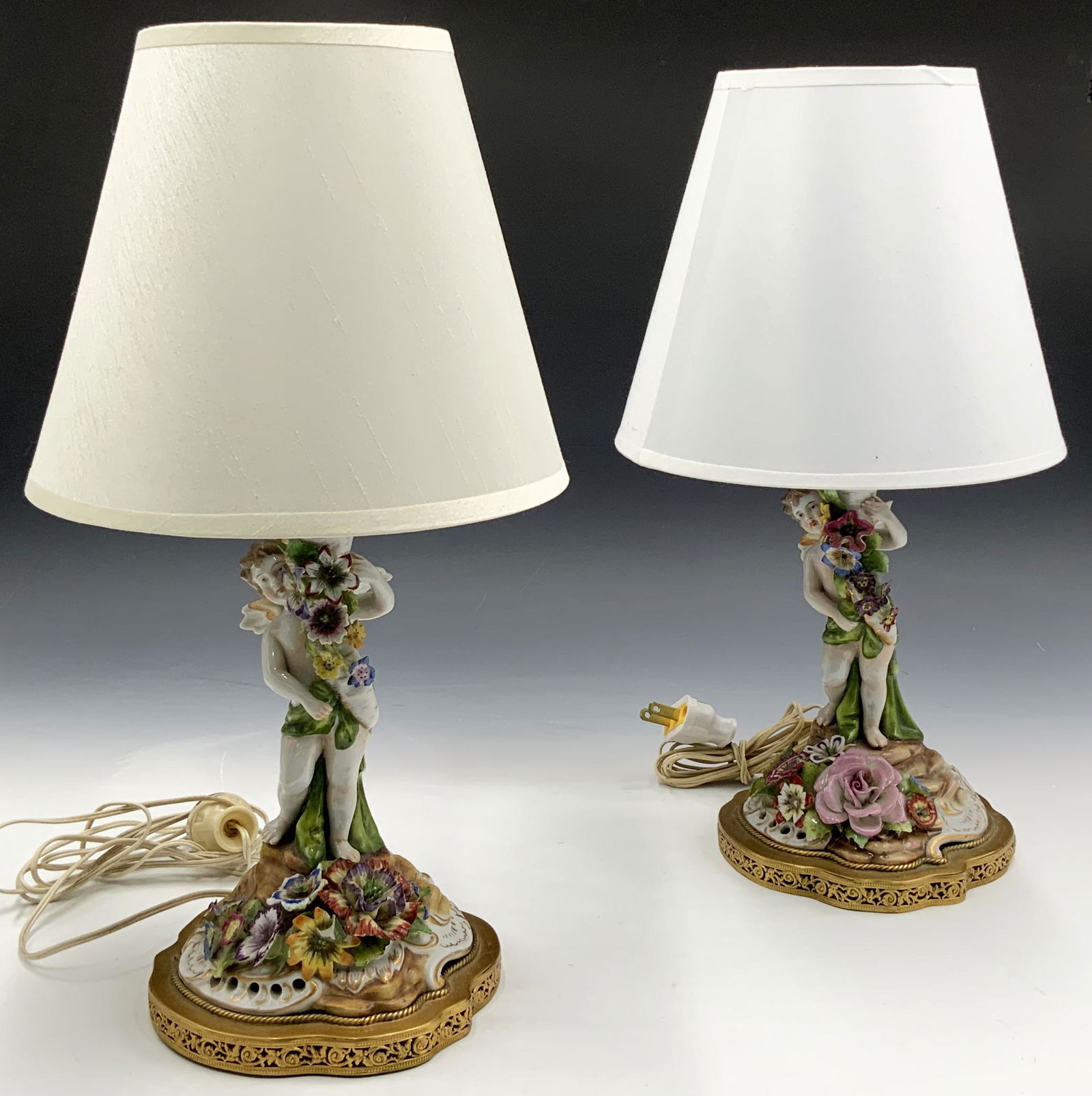 Pair of Vintage Cherub Table Lamps.: Including shades, these are each 15" tall. There is chipping on some of the flowers. Third-Party Shipping or Personal Pickup Required.