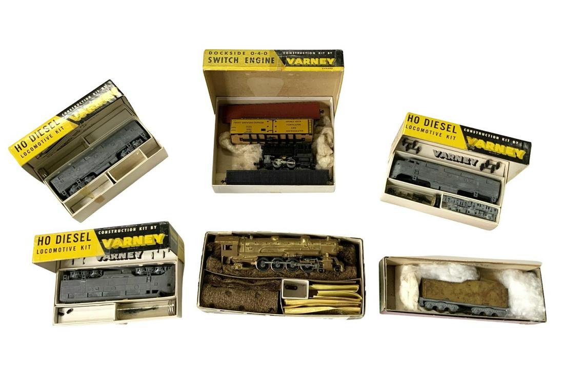 Lot of Mostly Varney HO Train Engines, Cars & Kits: Vintage, With the Original Boxes. Mostly Metal. The Gold-Colored Engine is by Bowser. Also, there is a Varney #1865-A Gold-Colored Tender Kit, a Varney Dockside 0-4-0 Switch Engine Kit, a Varney F-3 D