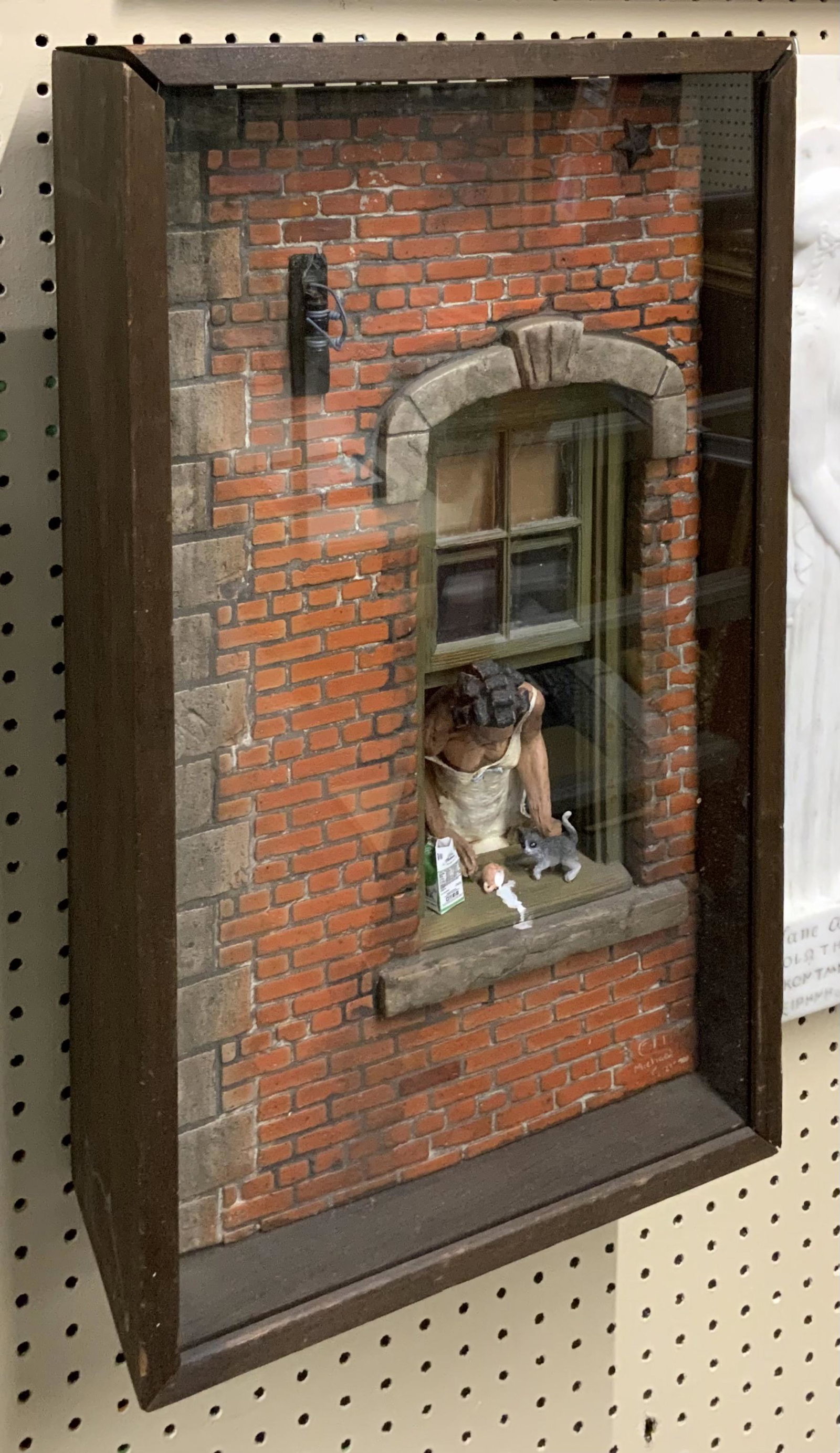 Michael Garman Diarama - Woman in Window w/Cat.: Titled "Spilt Milk". Measures 24" Long by 13 1/2" Wide by 6 1/4" Deep. The Top Panel on it is Loose, and has some Wear, but Otherwise it's in Good Shape. Third-Party Shipping or Personal Pickup Requir