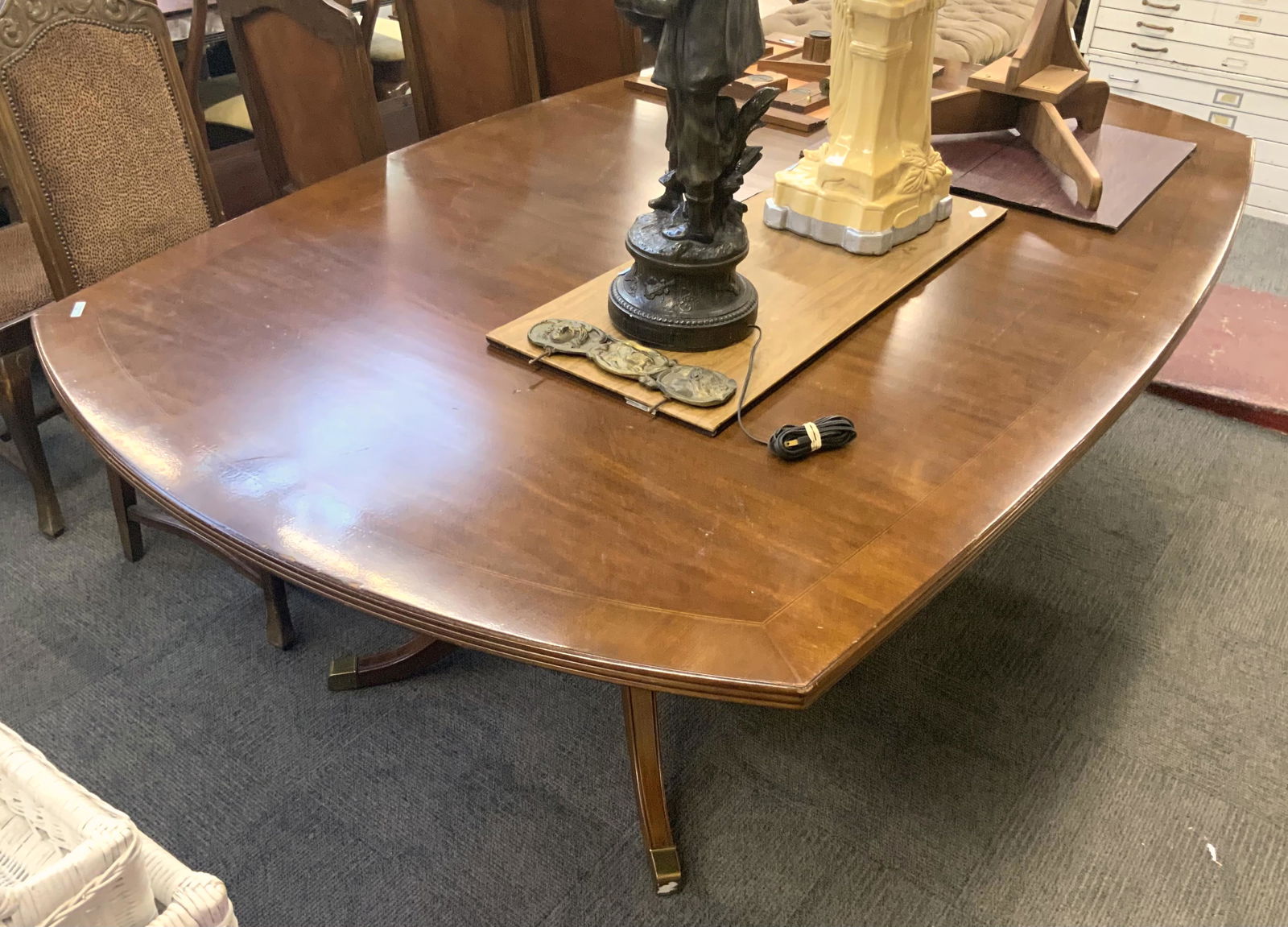 Large Mahogany Banded Dining / Conference Table.: With Duncan-Phyfe Style Legs. There are some Scratches / Indentation on the Side and Top End of the Table. The Table Measures 97" Long, 55 1/2" Wide, and 29" Tall. Third-Party Freight Shipping or Pers