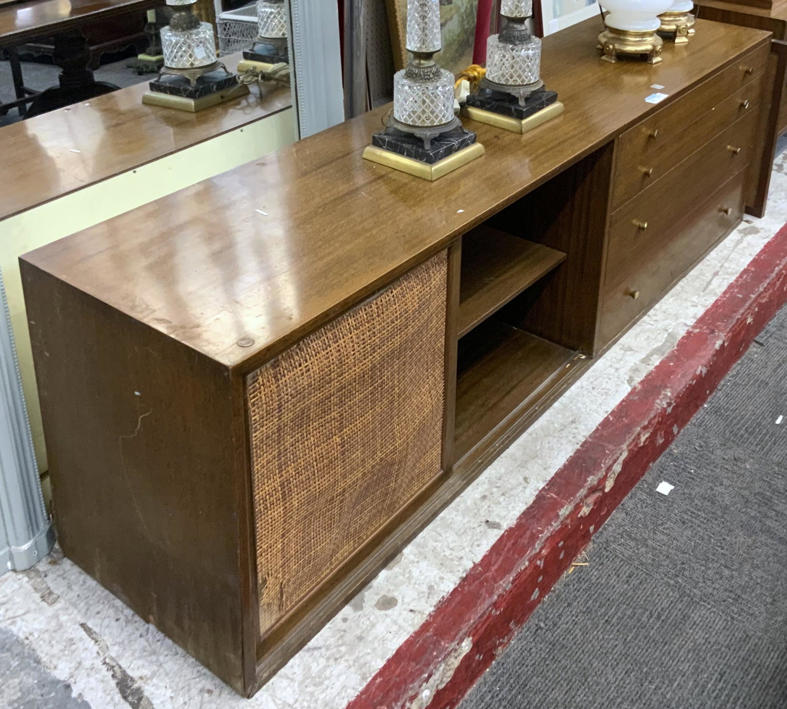 Harvey Probber Mid-Century Cabinet, AS IS.: With 4 Drawers and Sliding Doors. The Cane on the Sliding Doors are Damaged (Ripped and Torn). Also, it has No Legs, One Door is Off, and it has Water Damage on One Side. Third-Party Freight Shipping 