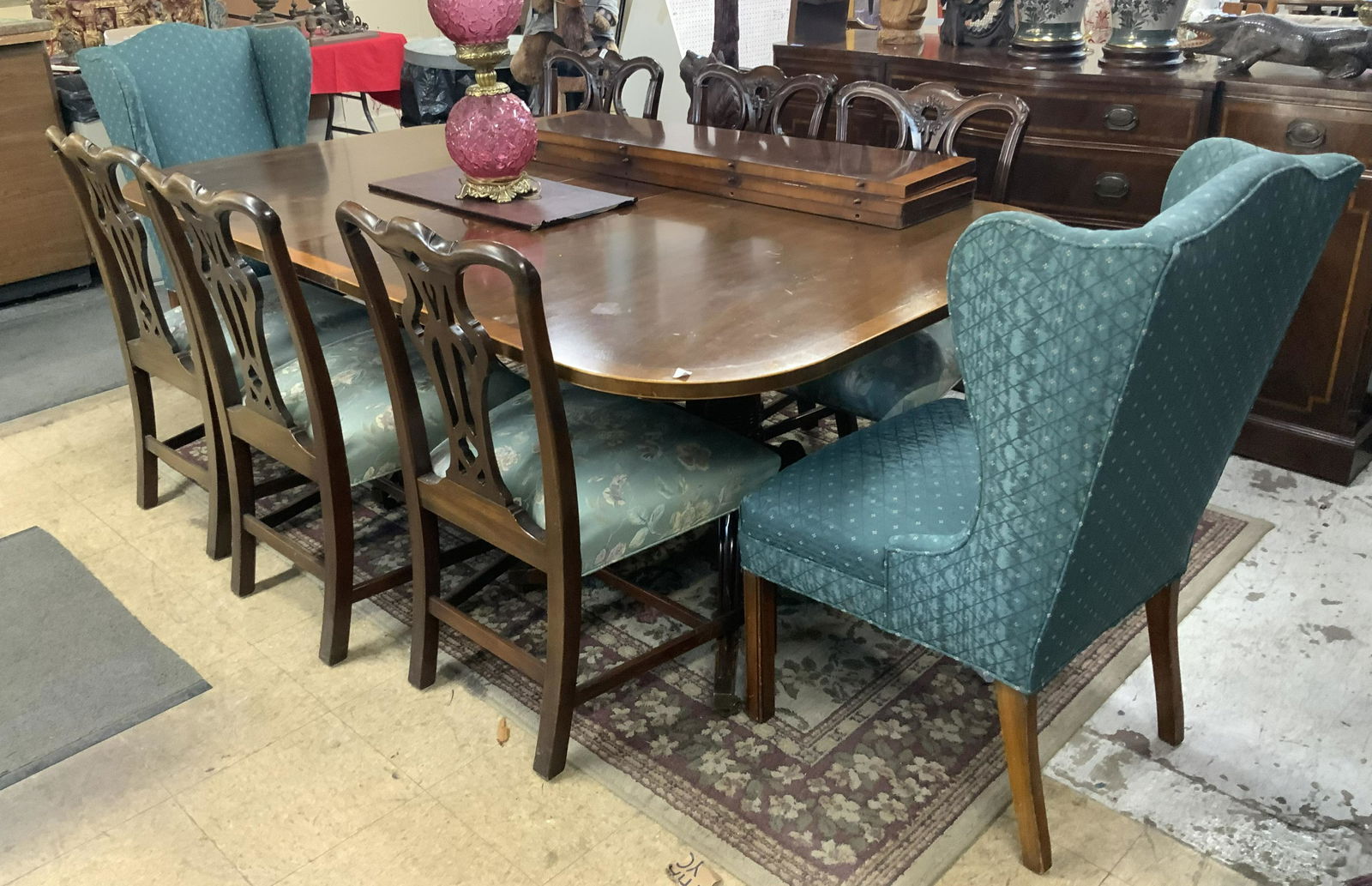 Mahogany Banded & Inlaid Dining Table & 8 Chairs.: With 6 Chippendale-Style Dining Chairs & 2 Upholstered Captain's Chairs. There are Several Water Stains on the Table. The Table Measures 83" Long with One Leaf Inside (As Pictured), 48" Wide, and 29 1