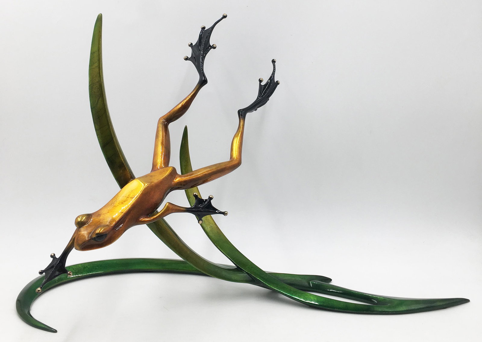 Large Tim Cotterill Diving Frog Bronze Sculpture.: Nice condition overall, with some areas of enamel loss along the lower edge of one of the leaves. The frog also has some enamel loss on his left eyelid. Measures 14" tall, 20.5" long, 8" wide. Fairly