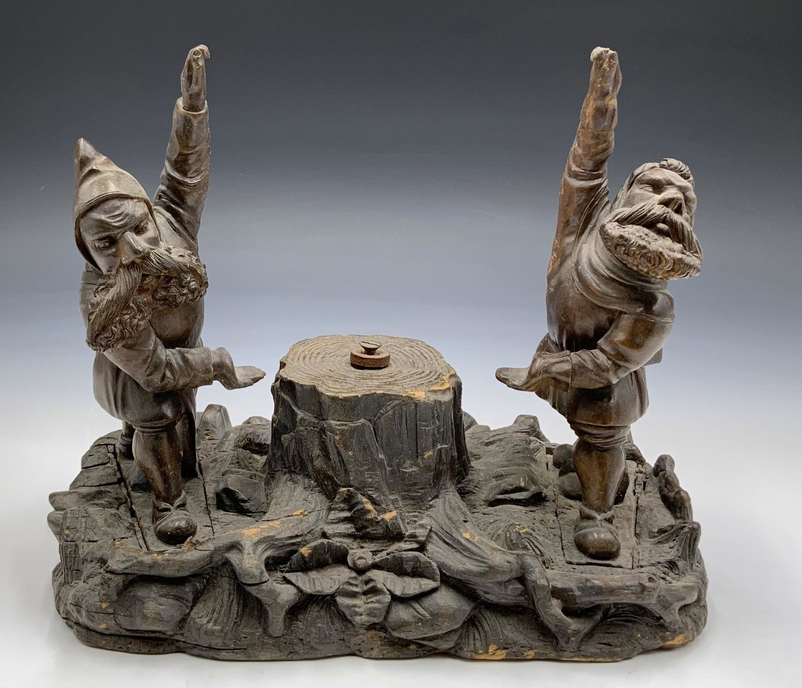 Black Forest Carved Mirror Holder w/Gnome Figures.: Missing the Mirror Portion. The Gnomes would be Holding the Mirror. The Piece is Dusty, and has some Worn areas to the Wood. Intricately Carved, it Measures 9" Tall, 10 1/2" Wide, and 5 3/4" Deep. Thi
