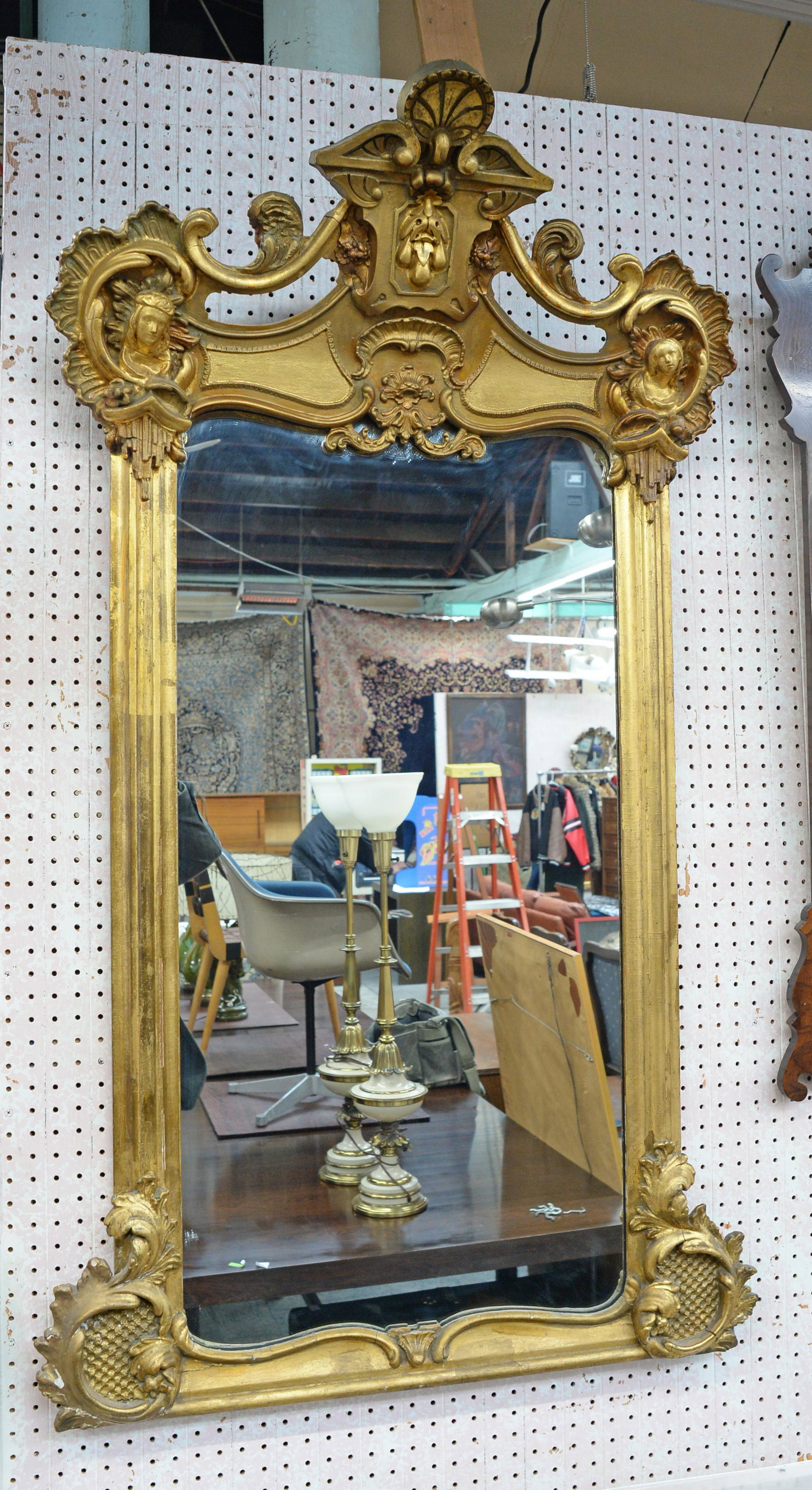 Antique Art Nouveau Gesso Mirror with Faces.: Gold Painted / Gilt. Some of the Paint is Missing from the Lower Left Hand Corner. There are some Minor Cracks to the Frame Elsewhere, but the Mirror is in Good Overall Condition. It Measures appx. 56