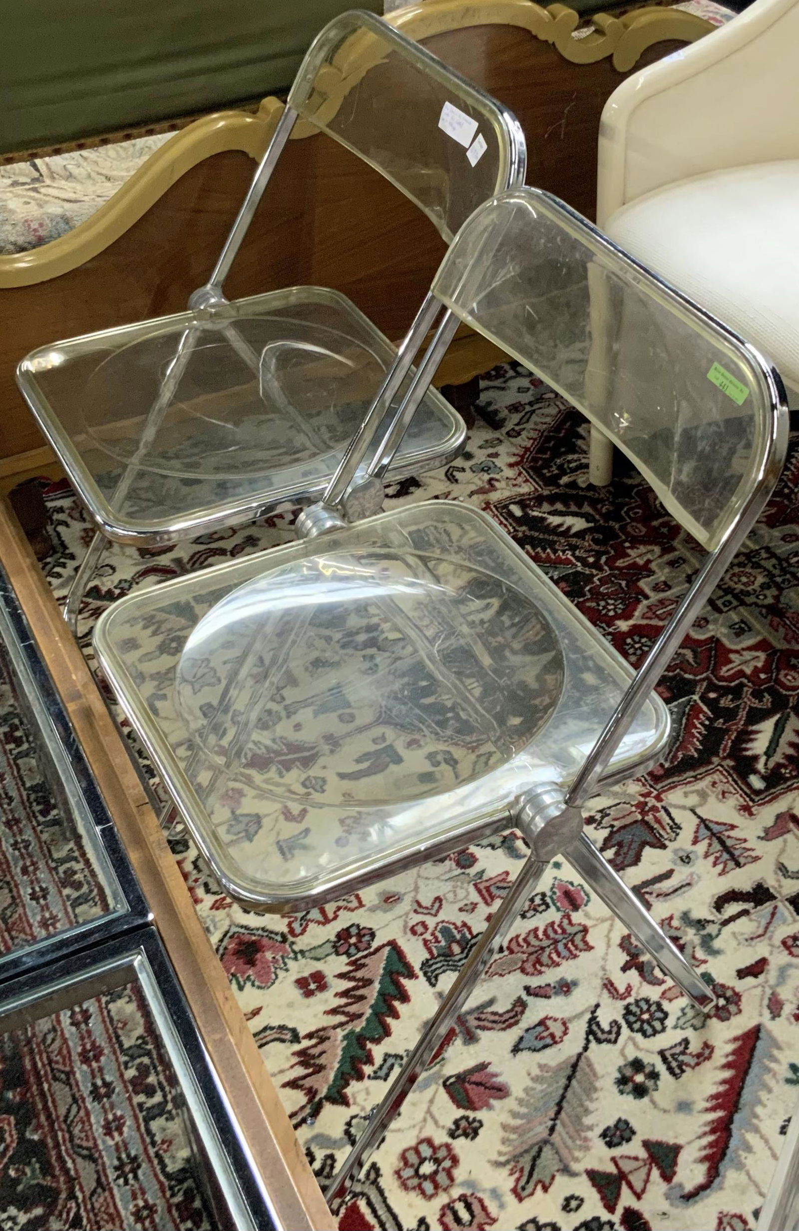 Pair of Castelli "Plia" Lucite Folding Chairs.: Giancarlo Piretti for Castelli. These have some Scratches. Third-Party Freight Shipping or Personal Pickup Required.