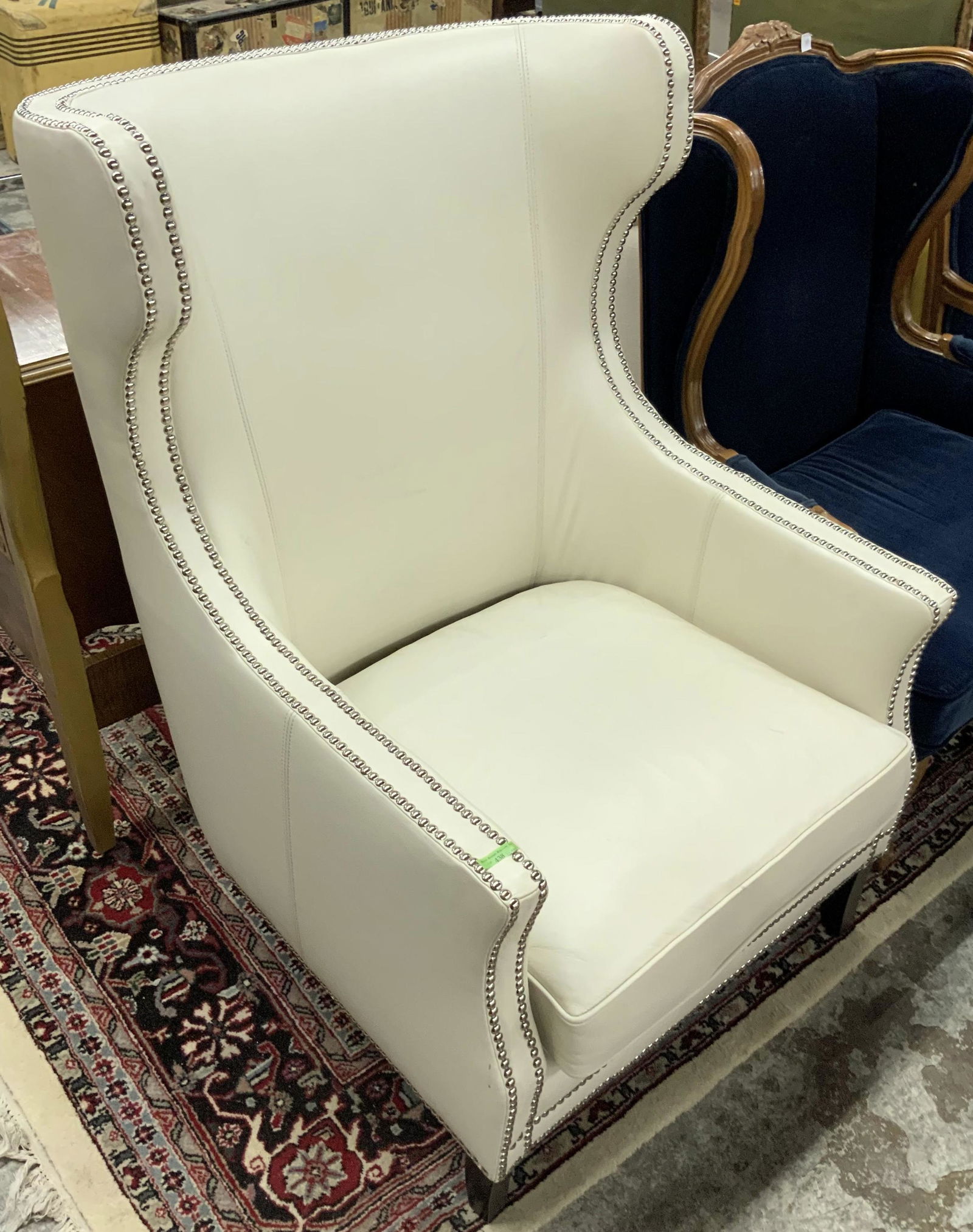 Beige Leather Studded Wingback Chair.: With the Label "Bernhardt Furniture - Z Gallerie". In Very Nice Condition, with the Exception of a Few Scratches on the Seat. The Chair Measures 44" High, 29 1/2" Wide, and 30" Deep. Third-Party Freig