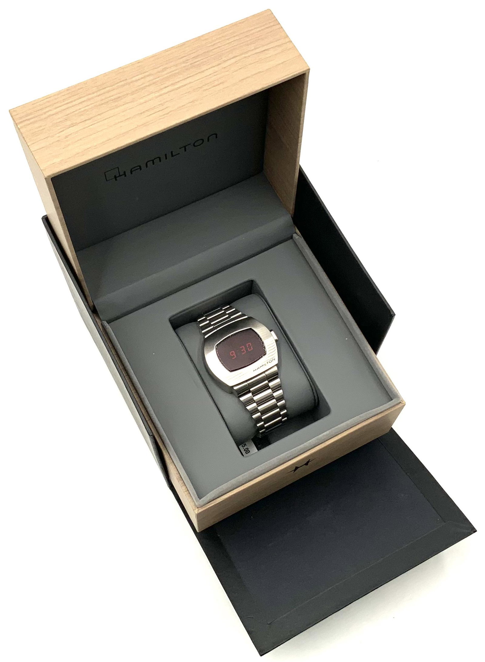 Hamilton American Classic PSR Digital Quartz Watch: In Outstanding Condition - Barely Worn. Works and Keeps Time. The Men's Watch Measures 40mm Wide and 33mm Long. Extra Links are Included, along with the Original Box (Which is Also in Excellent Condit
