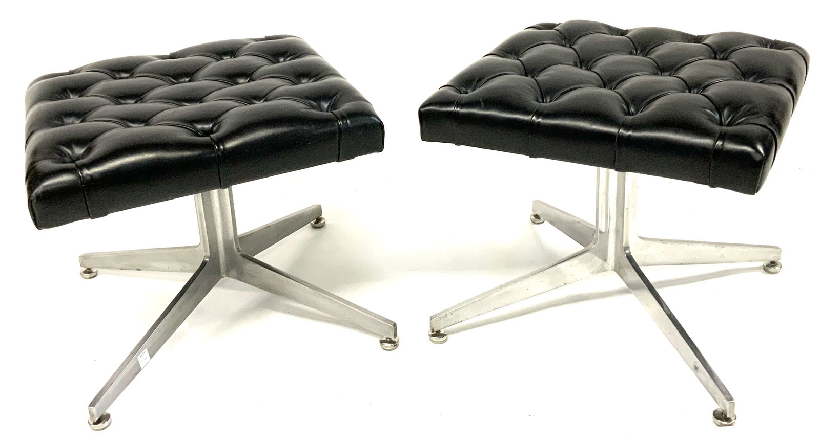 Pair of Ward Bennett Tufted Leather Ottomans.: Mid-Century. Ward Bennett for Lehigh Leopold. With a Lehigh Furniture Tag Taped to the Bottom of One of the Ottomans. These are in Good Overall Condition. They Measure 17" Tall, and 19 1/2" Square. Th