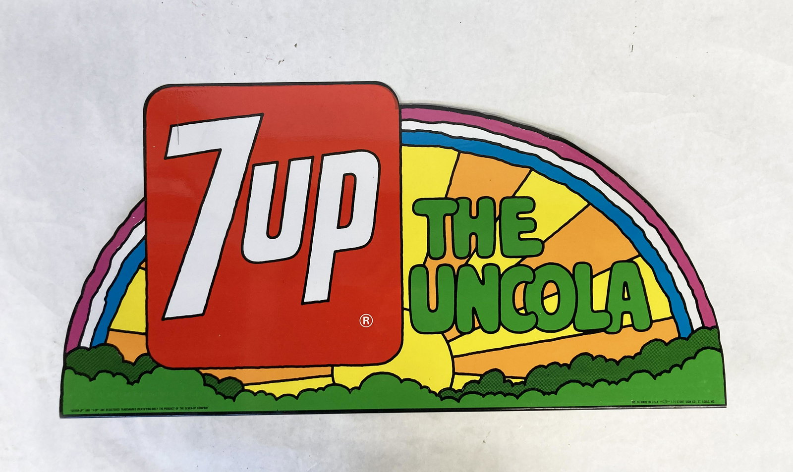 "7up - The Uncola" Advertising Sign.: A Flange-Type of Sign, which Stands Up. Made by the Stout Sign Company in St. Louis, Missouri. It Measures 23 3/4" Wide and 12" High. It has a Scratch over the 7, but is in Otherwise Very Good Overall