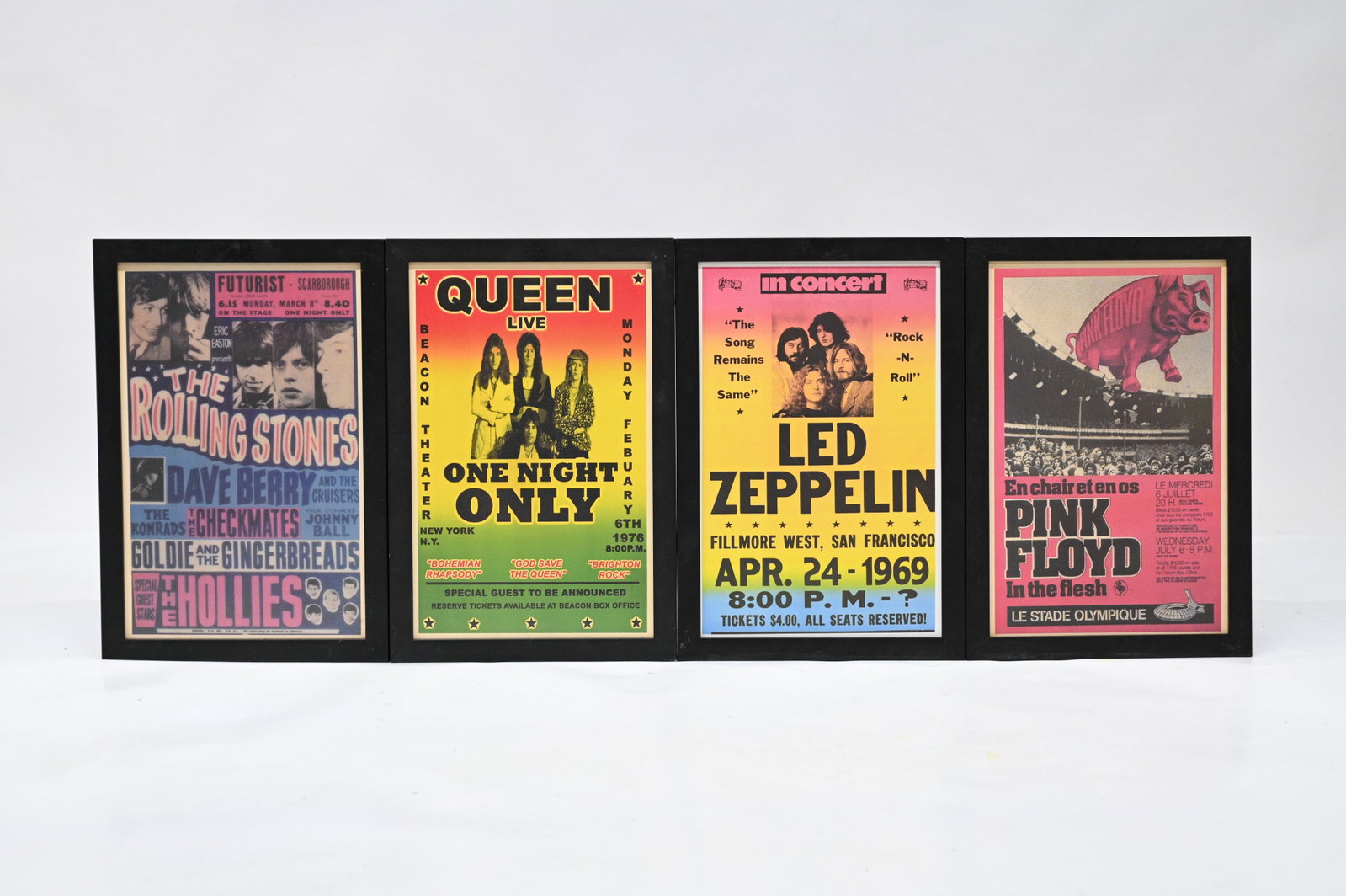 Lot of 4 Small Framed Reproduction Rock Posters.: Queen, Rolling Stones, Pink Floyd and Led Zeppelin. These Measure 16 1/2" x 10 1/2". The Frames measure 18 5/8" x 12 5/8". The Frames have a bit of Wear. Third-Party Shipping or Personal Pickup Requir
