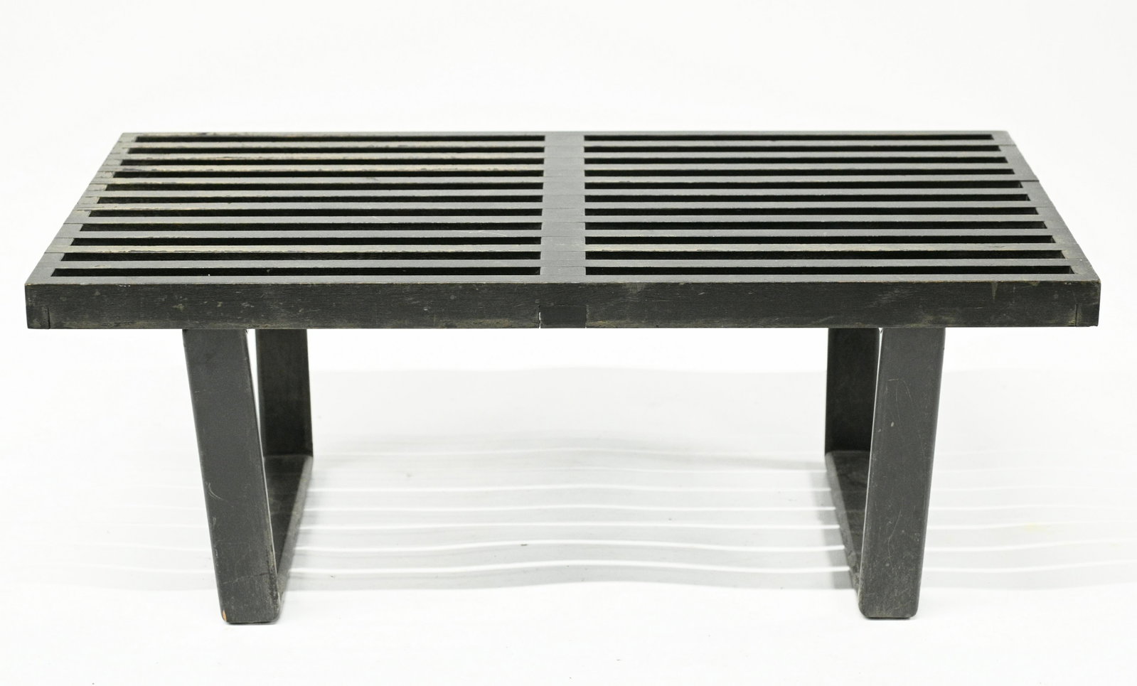 Small George Nelson Mid-Century Bench.: Has some Loss to the Finish. One Leg is Loose, it Just Needs Re-Gluing. Measures 14" Tall, 36" Wide, and 18 1/2" Deep. Third-Party Shipping or Personal Pickup Required.