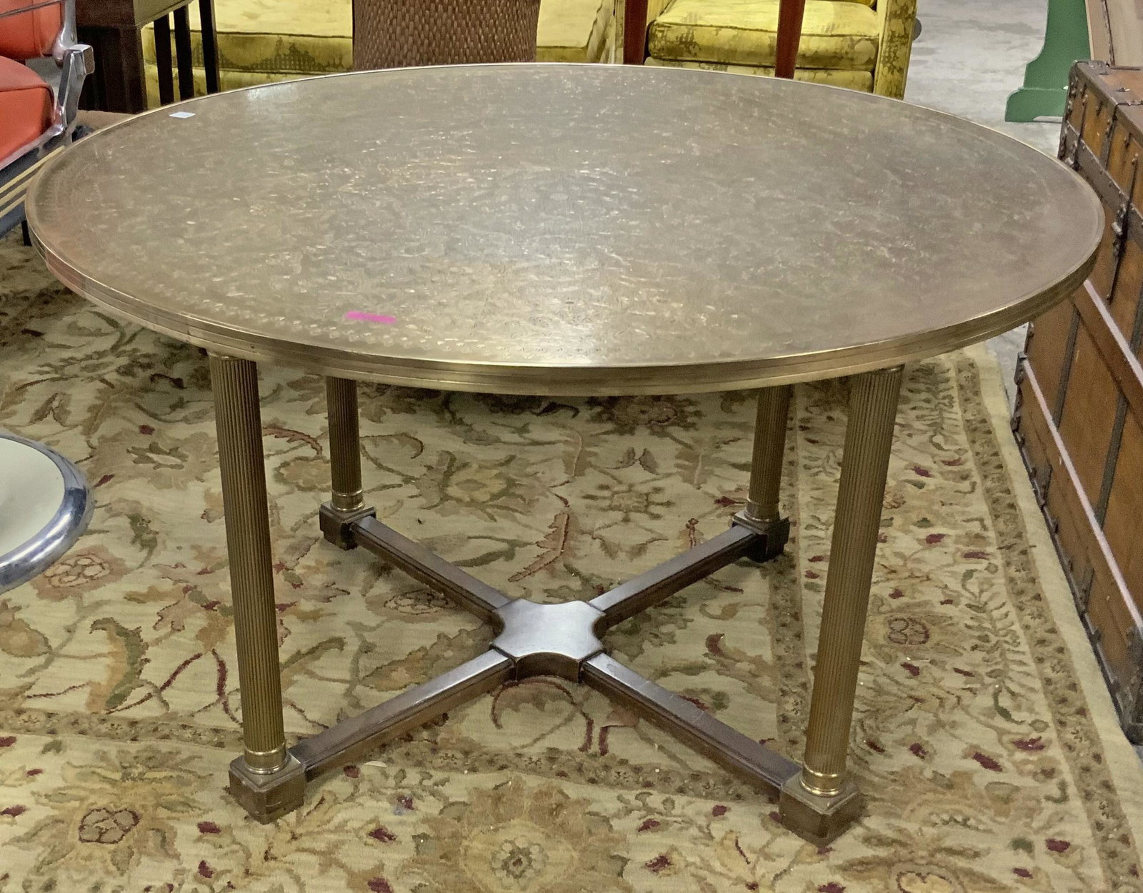 Brass Round Table with Middle-Eastern Style Top.: The Top is Engraved with Floral Designs. The Table is in Good Shape, but has a Couple of Small Dark Spots on the Top. It Measures 26" Tall, and 45" in Diameter. Third-Party Freight Shipping or Persona