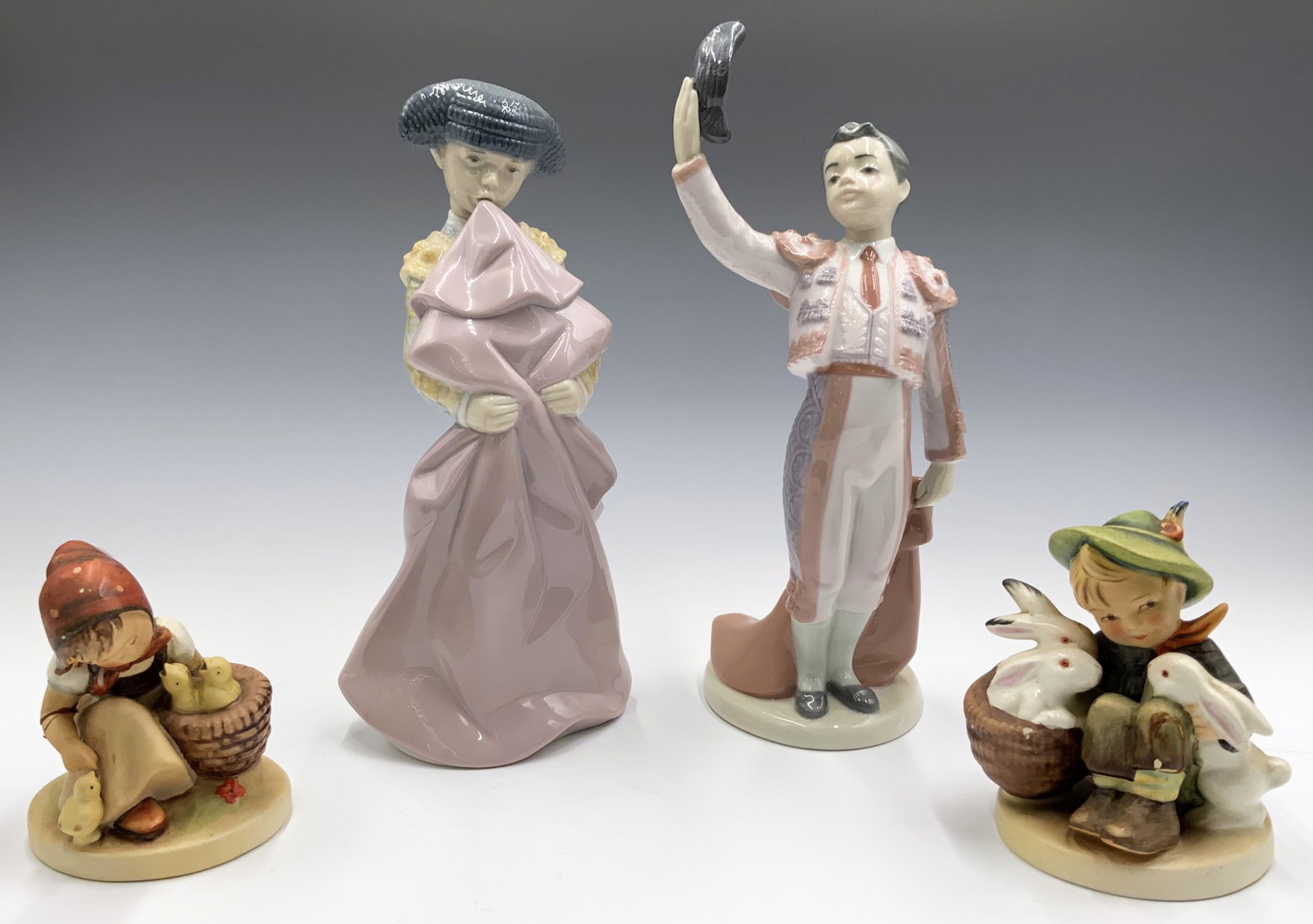 Lot: 2 Lladro Matador Figurines and 2 Hummels.: The tallest figure is 10". The Lladros are in very nice shape. The Hummels have both been repaired, and are in rough shape. Third-Party Shipping or Personal Pickup Required.