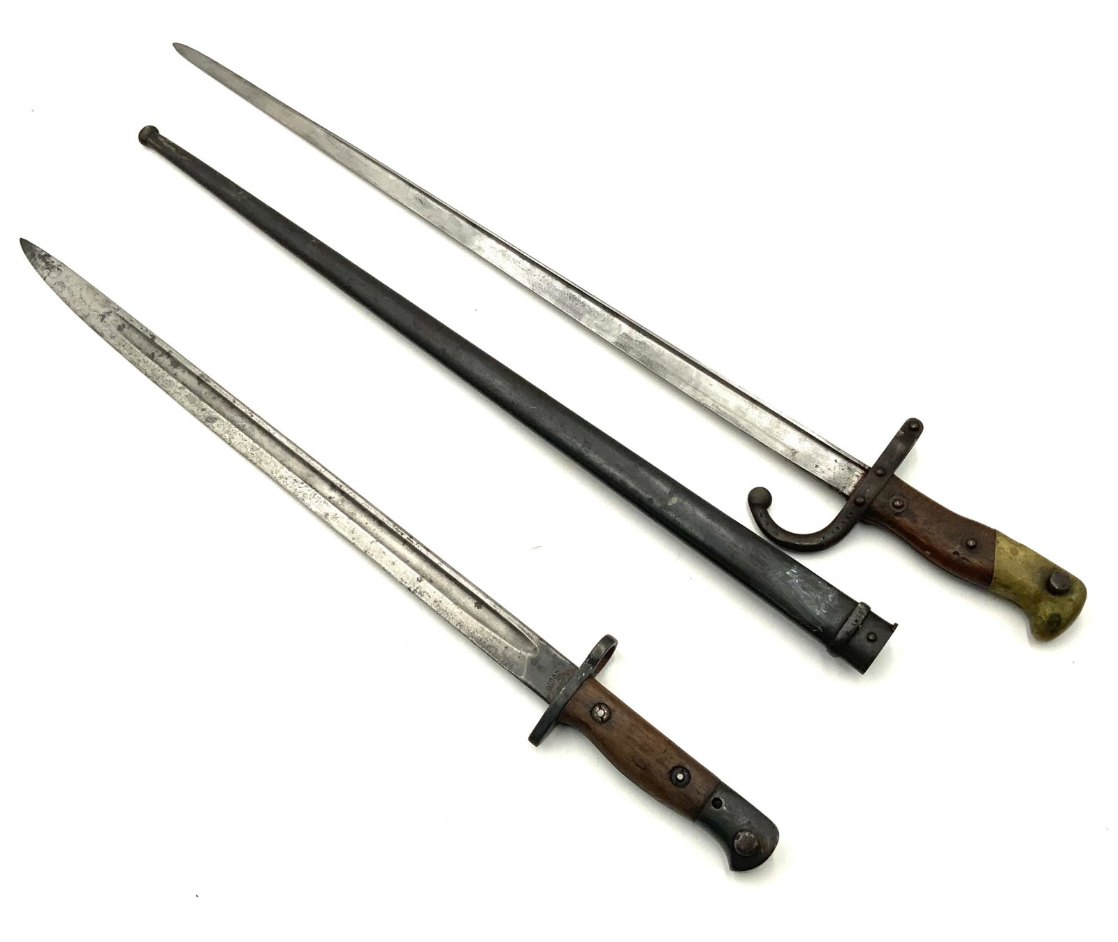 Lot: 2 Smaller Antique Bayonets, 1 Has a Scabbard.: One of the swords is engraved, "L. Deny Paris 1880". The longer one is 26.5". Third-Party Shipping or Personal Pickup Required.