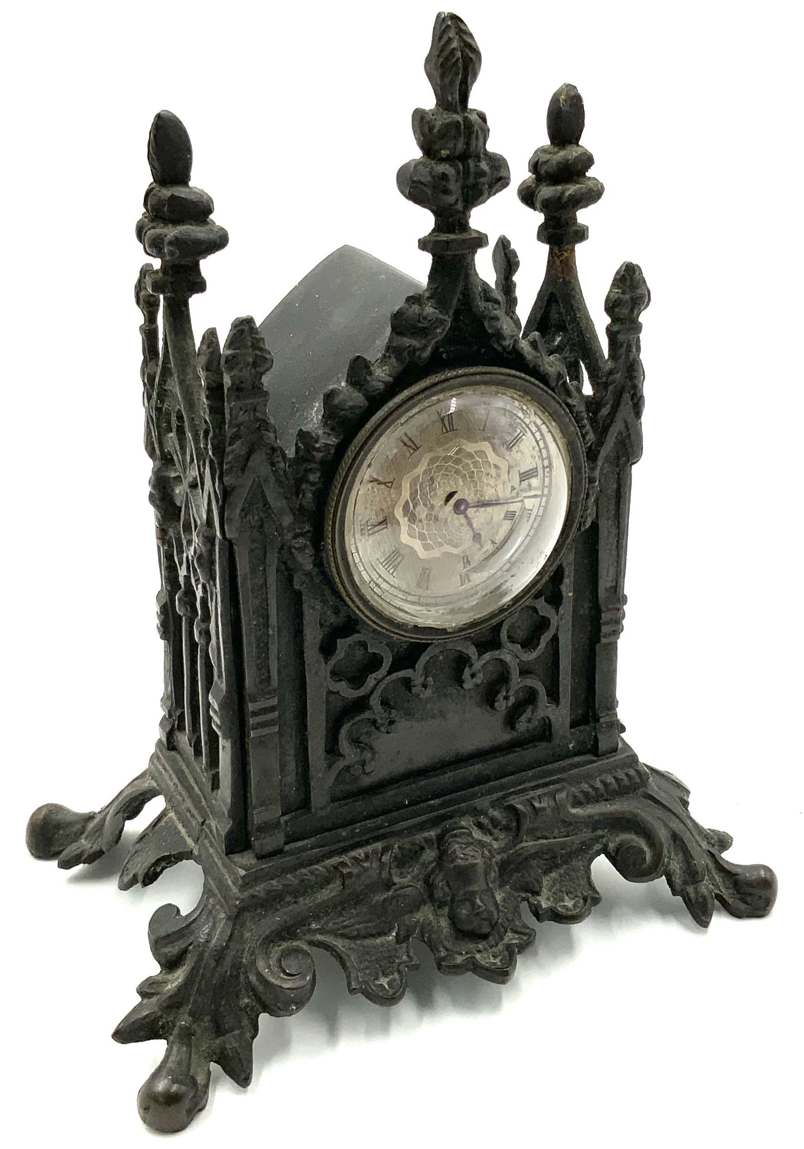 Victorian Cast Iron Steeple Clock w/ Cherub Face. (1 of 4)
