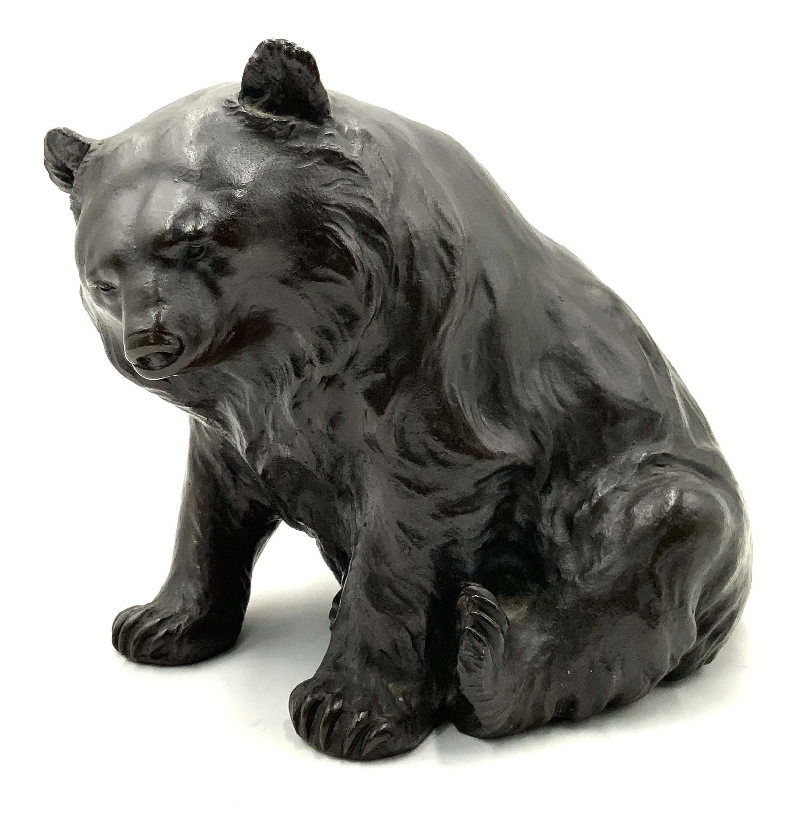 Bronze Sculpture of a Grizzly Bear.: He is 8" tall, 8" long, isn't too heavy. Marked underneath, country of origin is unknown. Looks to be in nice condition. Third-Party Shipping or Personal Pickup Required.