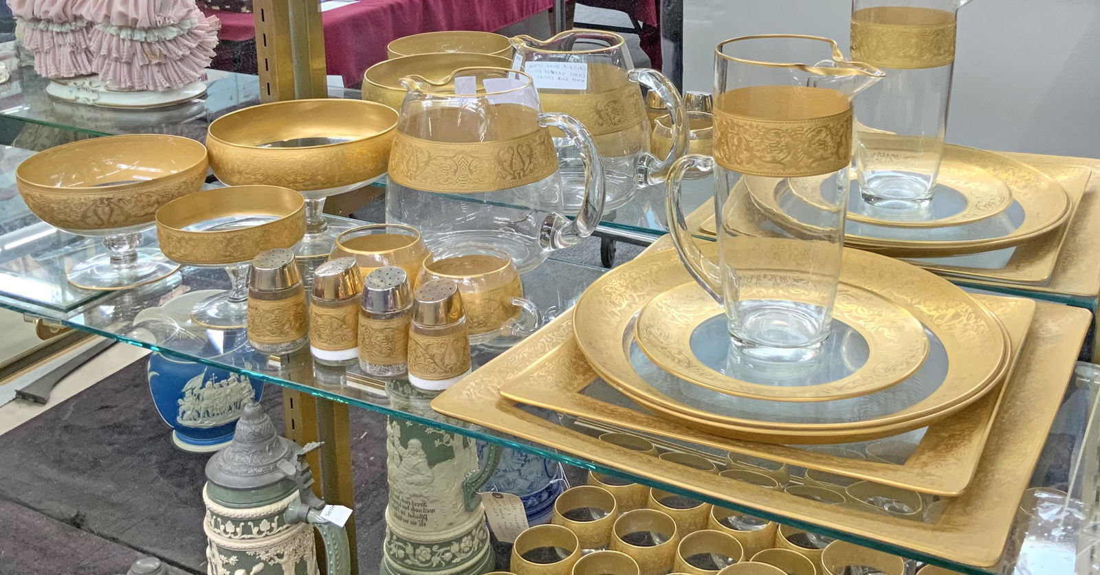 Lot of Gold-Rim Moser Style Glass Serving Pieces.: Has Minor Gold Losses. The Shorter Pitcher Measures 6 3/4" Tall. The Taller PItcher Measures 8 3/4" Tall. The Largest Tray Measures 14 1/4" Square. Third-Party Shipping or Personal Pickup Required.