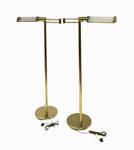 Pair of Casella Lighting Brass & Glass Floor Lamps: These Modern Floor Lamps have Arms that Can Swing Out. They Measure 45 1/2" Tall and 21 1/2" Wide when the Arms are Tucked In. Third-Party Shipping or Personal Pickup Required.