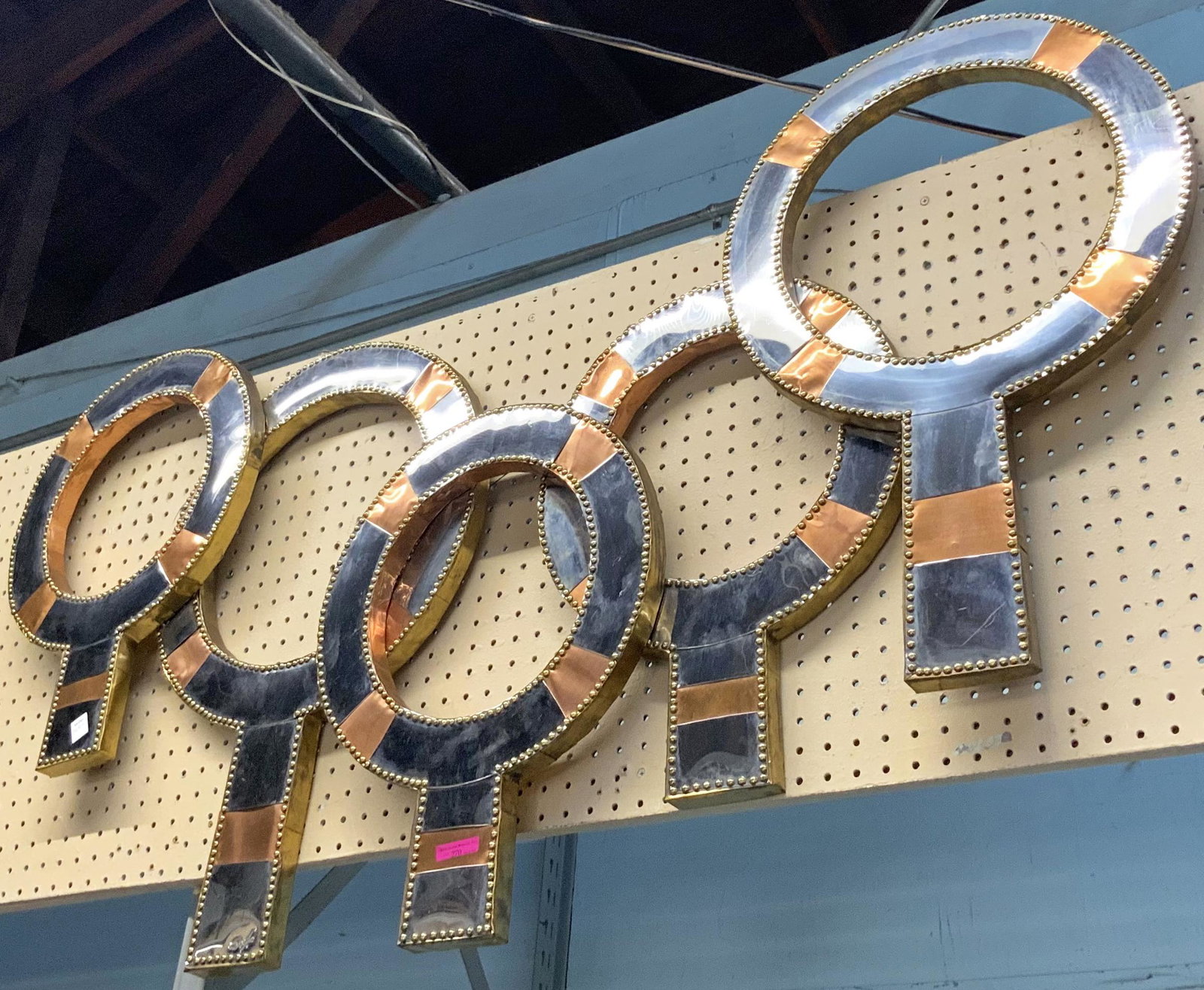 Modern Metal Foil Sculpture by Don Freedman.: This Don Freedman wall sculpture of overlapping hoops in various sizes is Signed "DF". It is in Good Overall Condition, measuring 56" wide and 34" tall. Third-Party Shipping or Personal Pickup Require