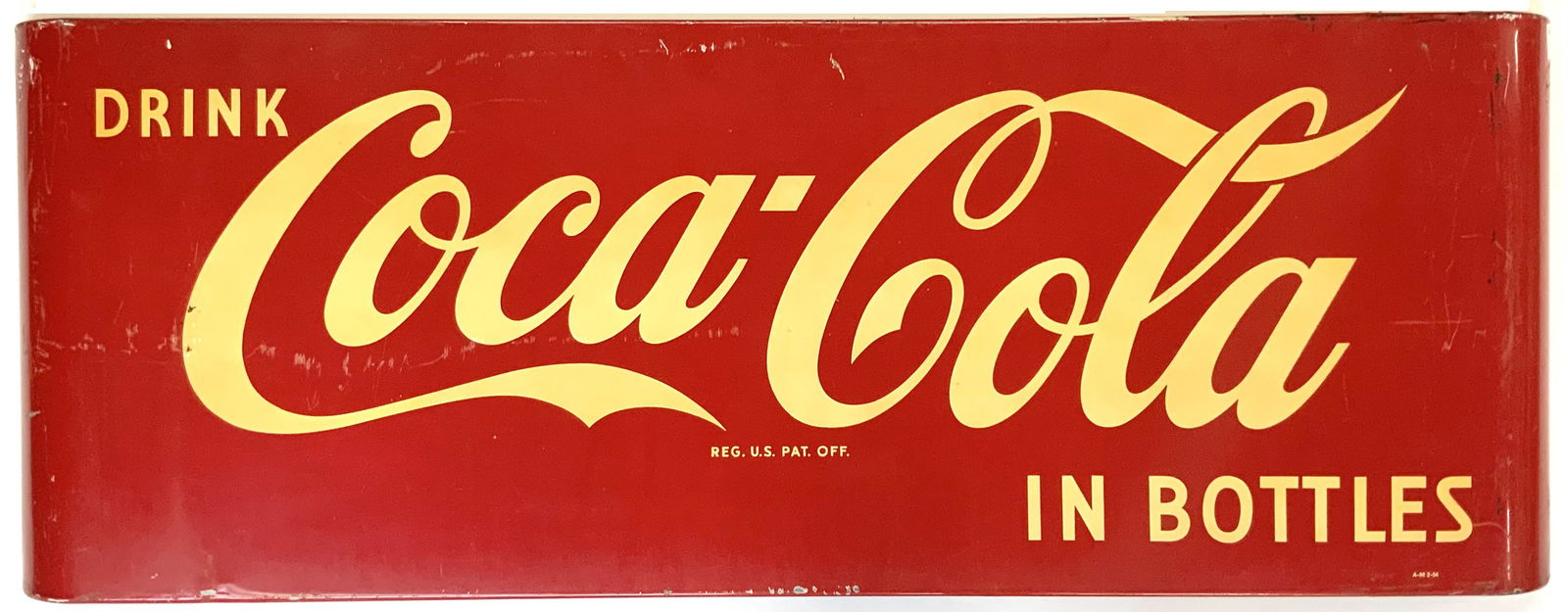 Vintage "Drink Coca-Cola in Bottles" Sign.: The Sign is Metal and enamel. It Measures 16" x 44", and is Moderately Heavy, Ready to Hang. There is a fair amount of Scratching and Surface wear, as well as some discoloration. Otherwise, it looks t