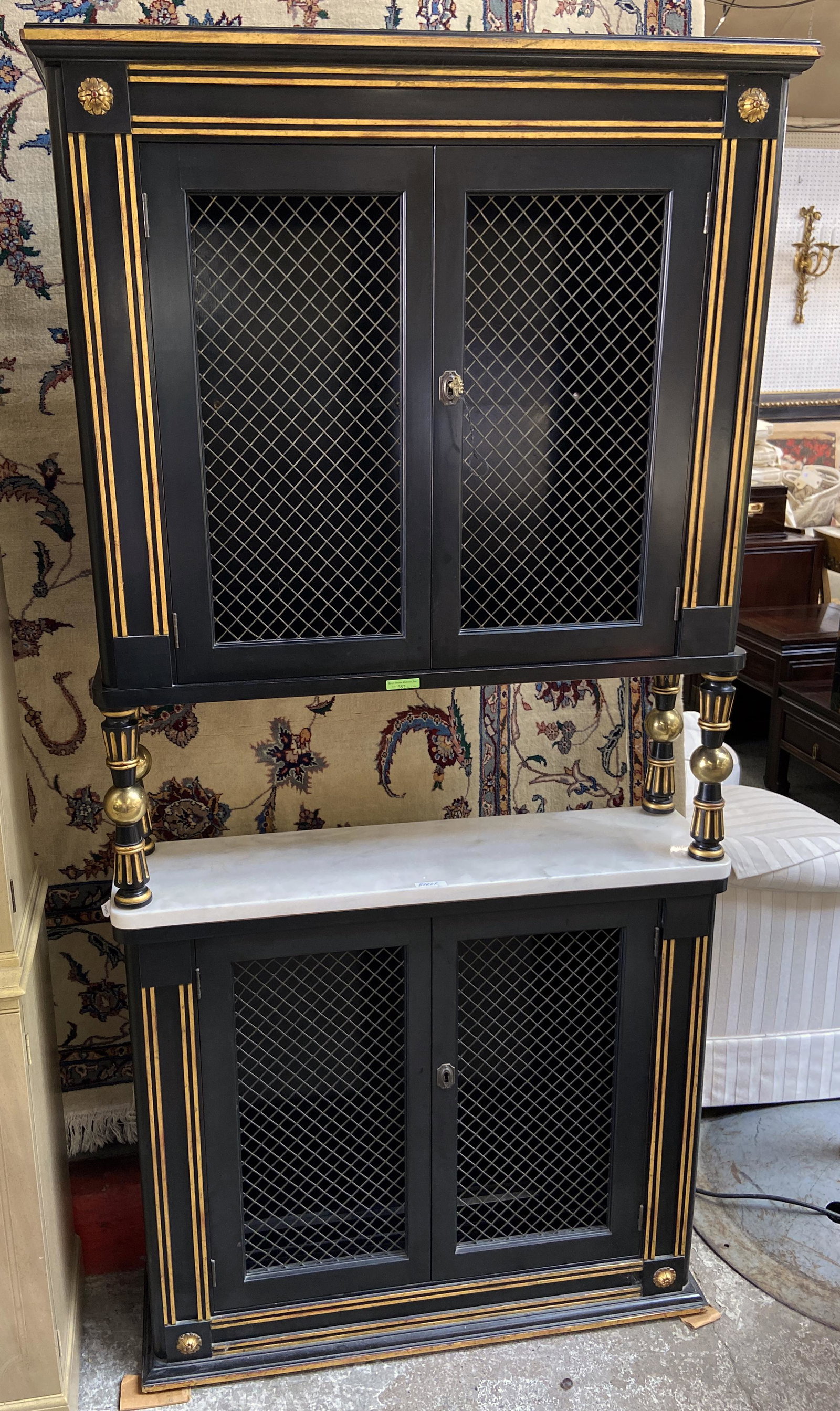 Black Finish Baker Wall Cabinet Wire Inserts: This wall cabinet is trimmed in gold and has a marble top. Perfect for a liquor cabinet or bar. Measurements:35" wide, 10" deep and 72" tall Third Party Freight Shipping or Personal Pick-up Required.