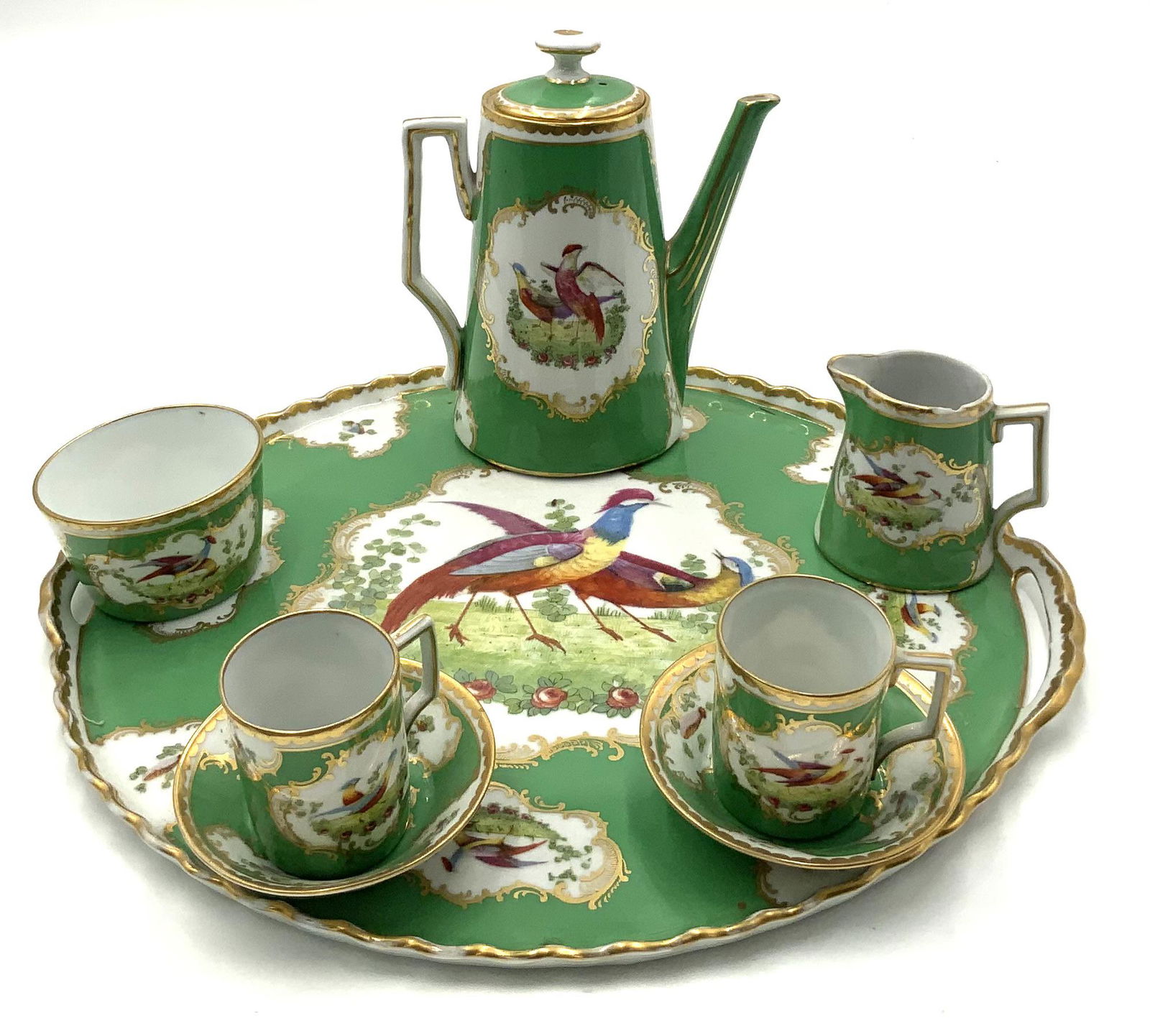 Antique Birds of Paradise Chocolate Set w/ Tray.: They are marked on the underside; it looks to be a "W" over an "M". The tray measures 14 1/2" in diameter; the tallest piece is 7" tall. The creamer is chipped, and has been repaired. Third-Party Ship