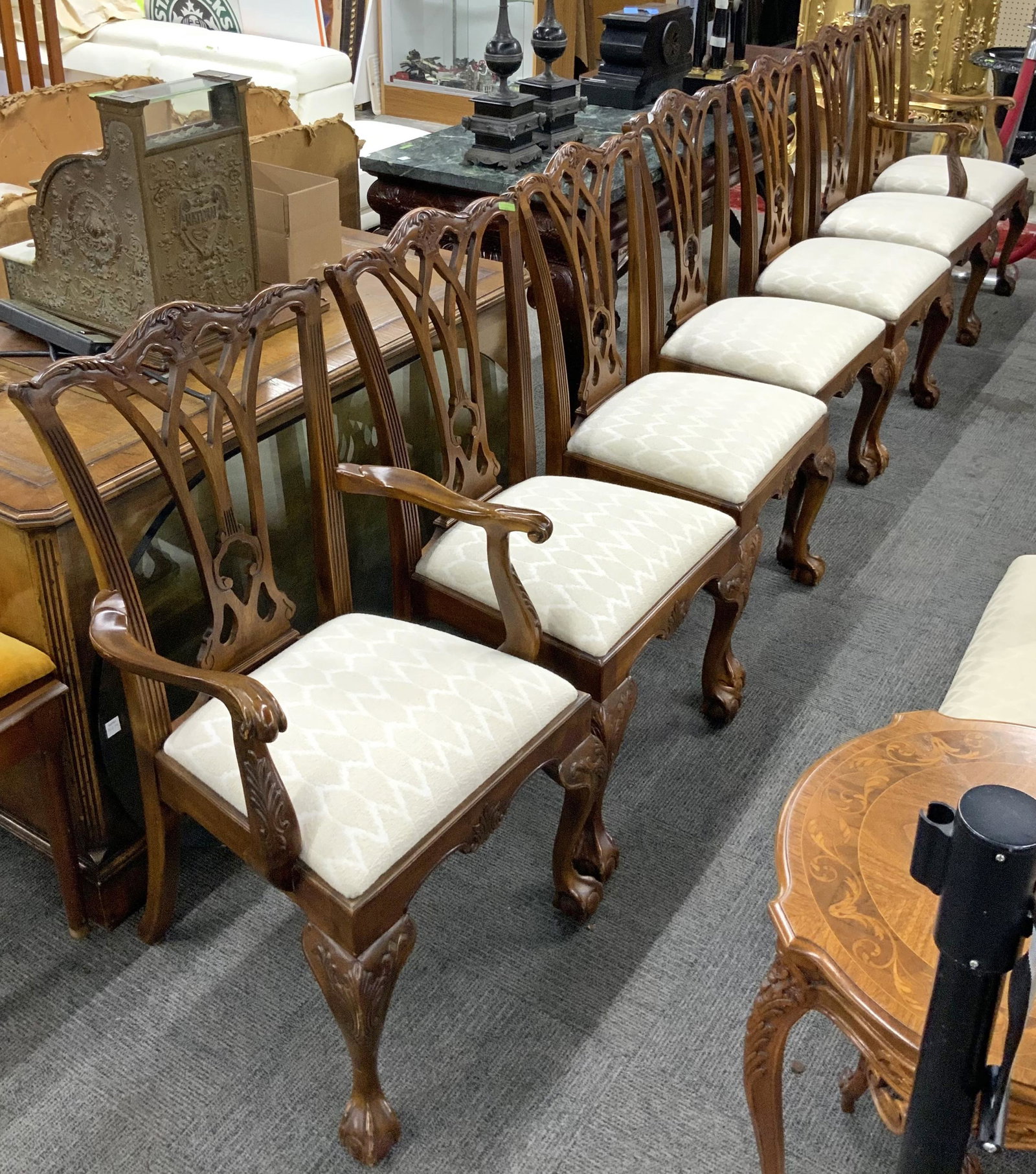 Set of 7 Walnut Finish Chippendale Dining Chairs.: There are 2 armchairs and 5 side chairs to this set. The seats are all in good condition and done in a beige textured fabric. The chairs are in Overall Good Condition. The armchairs measure 23" wide, 