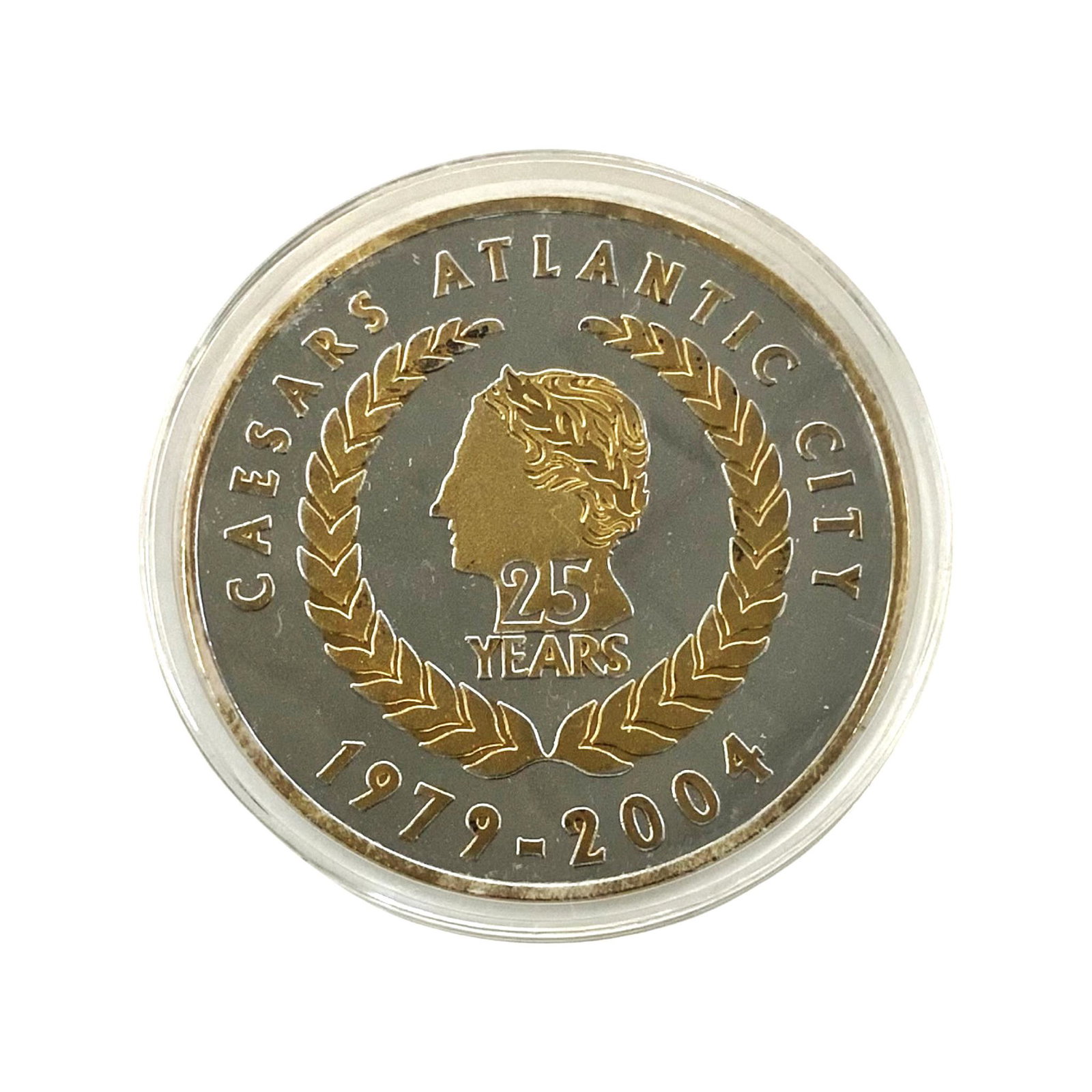 Caesars Atlantic City 25th Anniversary Silver Pc.: A Silver 25 Year Anniversary Token or Medallion from Caesar's Palace in Atlantic City, Dated 2004. The Round is .999 Silver, with Gold Accents. It is in a Plastic Case. It measures 2 1/2" in Diameter,