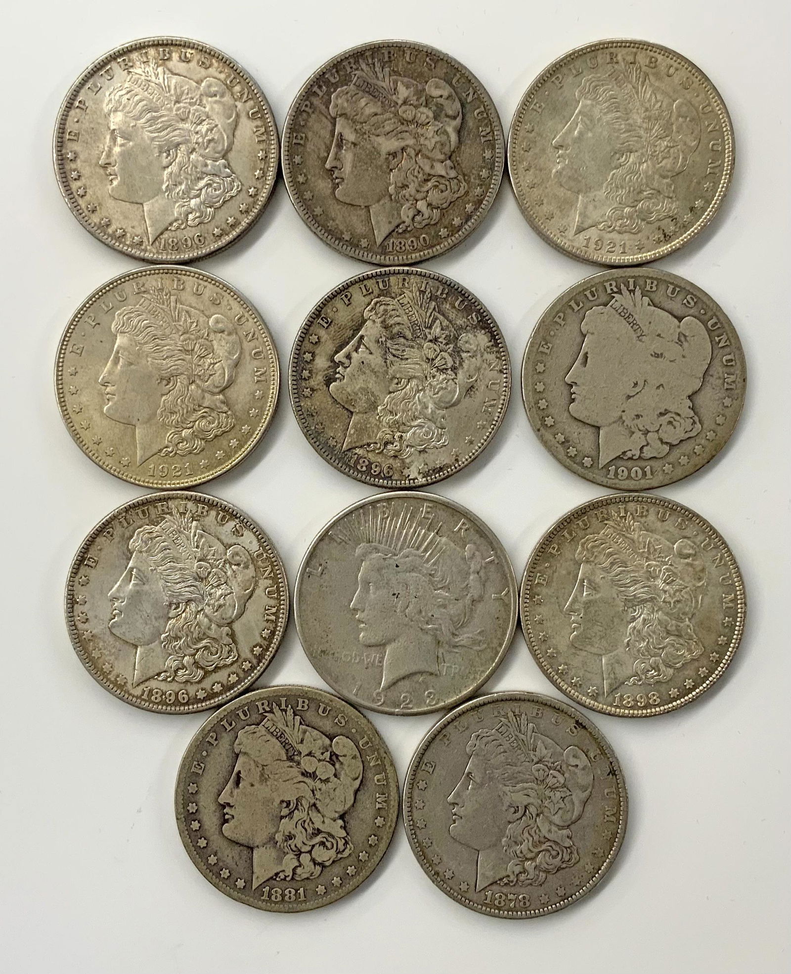 Lot of 11 Silver Dollars, mostly Morgans. (1 of 2)