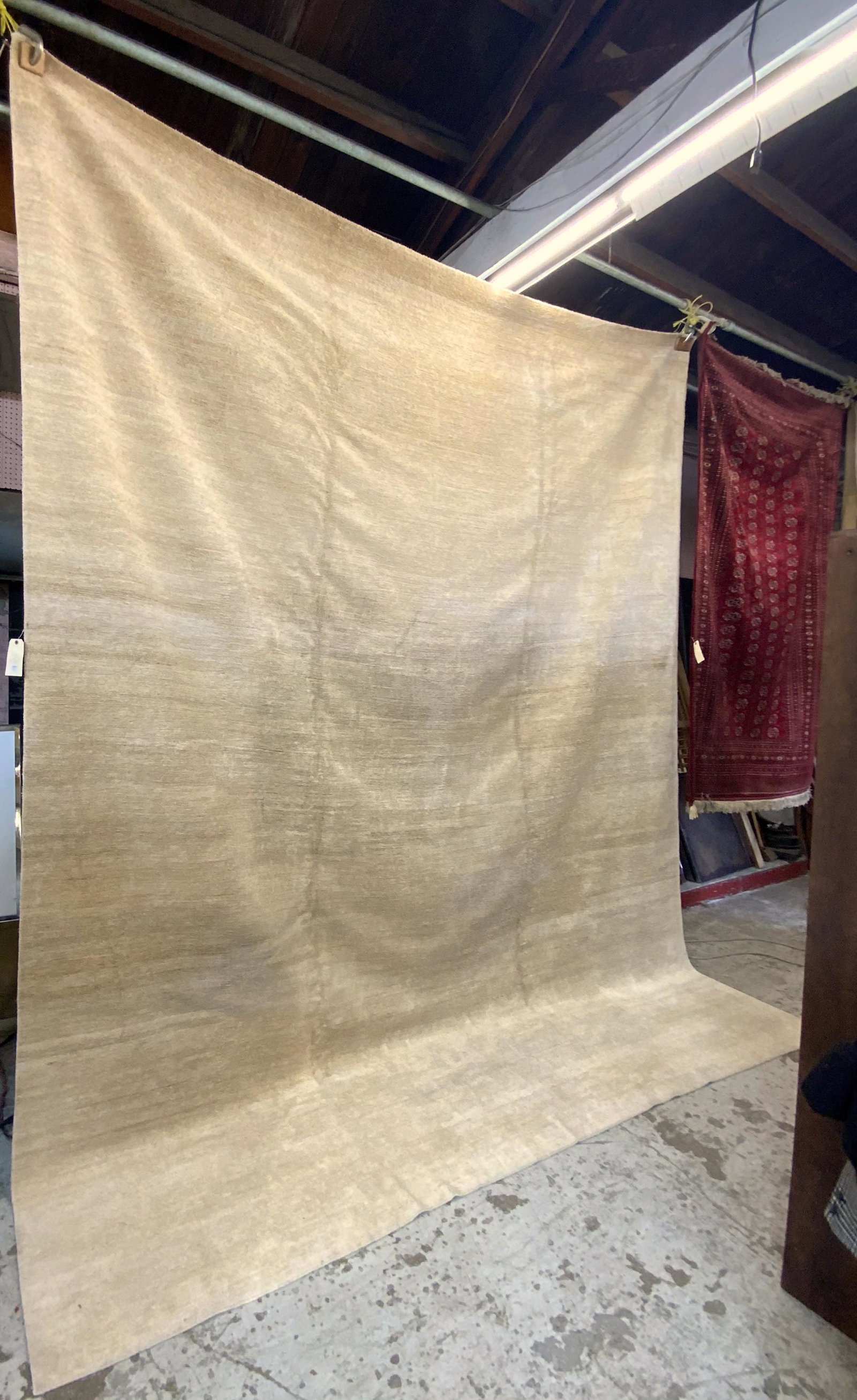 14' 10" by 11' 9" Beige Modern Natural Fiber Rug.: Third-Party Shipping or Personal Pickup Required. This is a tightly woven natural fiber rug with a short nap, meaning it has a course texture. There are no visible stains, rips or damage. Third Party 