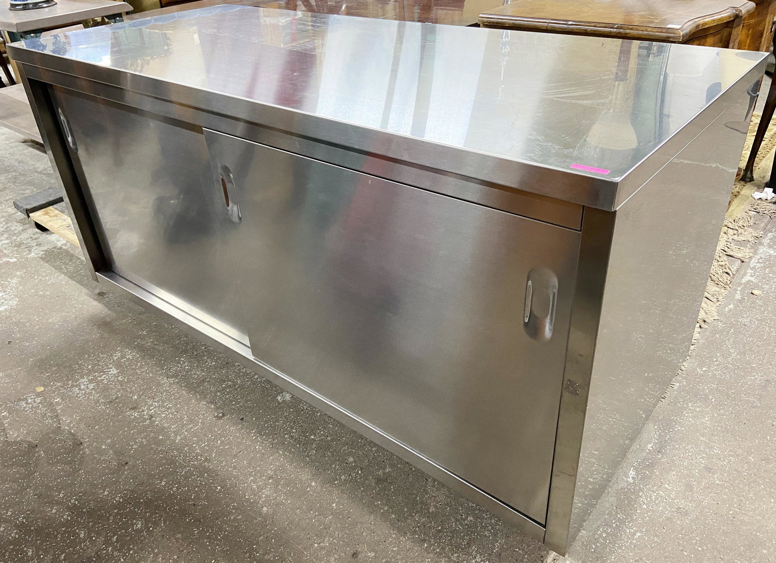 Quovis Stainless Steel Modern Credenza.: Designed by Giulio Lazzotti for Design within Reach. The Line was Launched in 2001, but the age of this Particular Credenza is not Known. It has a Number of Light Scratches on the Top, and a few small