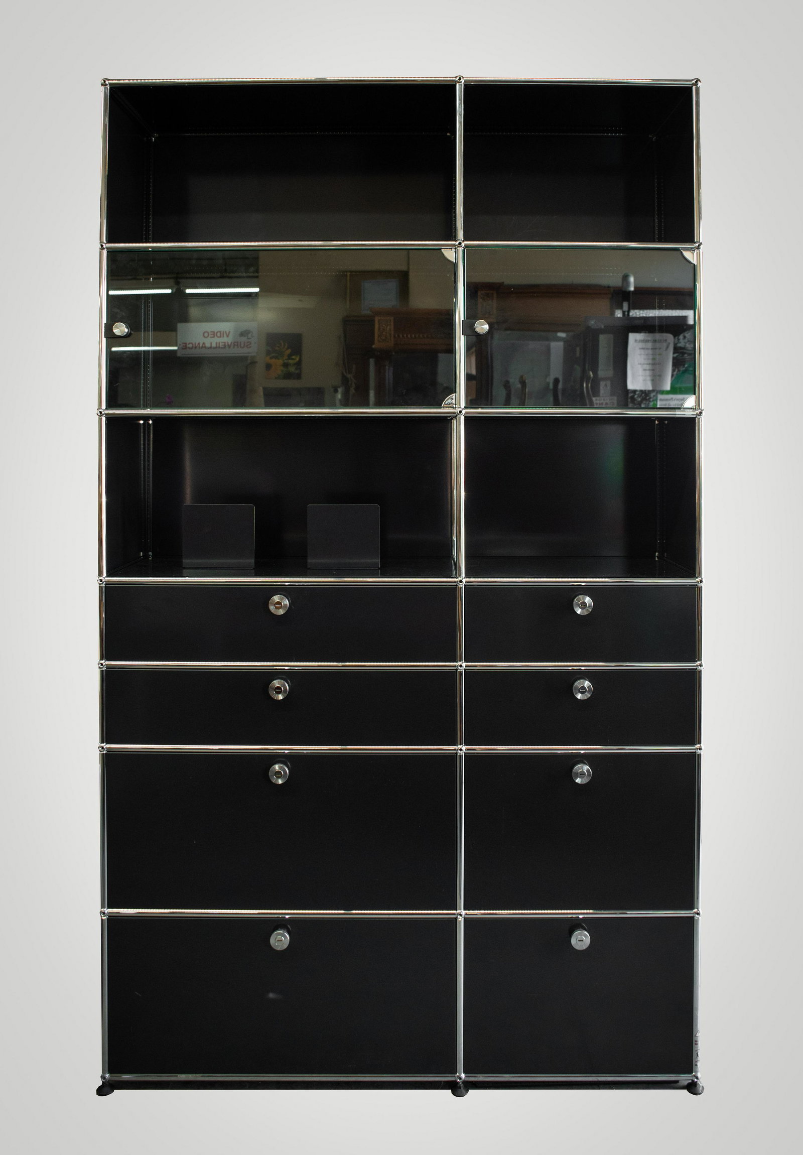 USM Haller Black Wall Unit.: This Unit was Purchased in 2019, and is in Excellent Condition. At the time, they Paid $13,800 for it. It is Very Difficult to Assemble, and Extremely Difficult to Make all the Lights all Work. The Un